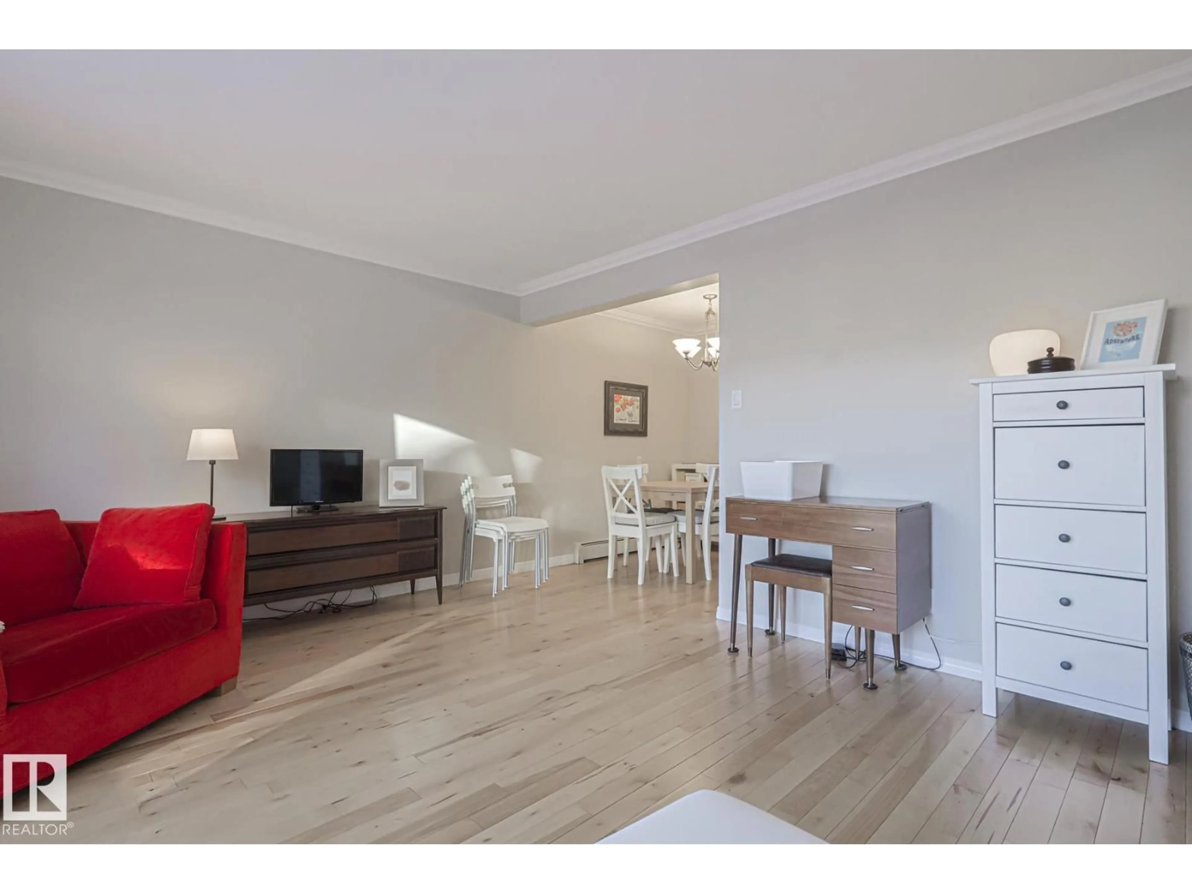 Living room with furniture, wood/laminate floor for 207 - 9925 83 AV, Edmonton Alberta T6E2B9