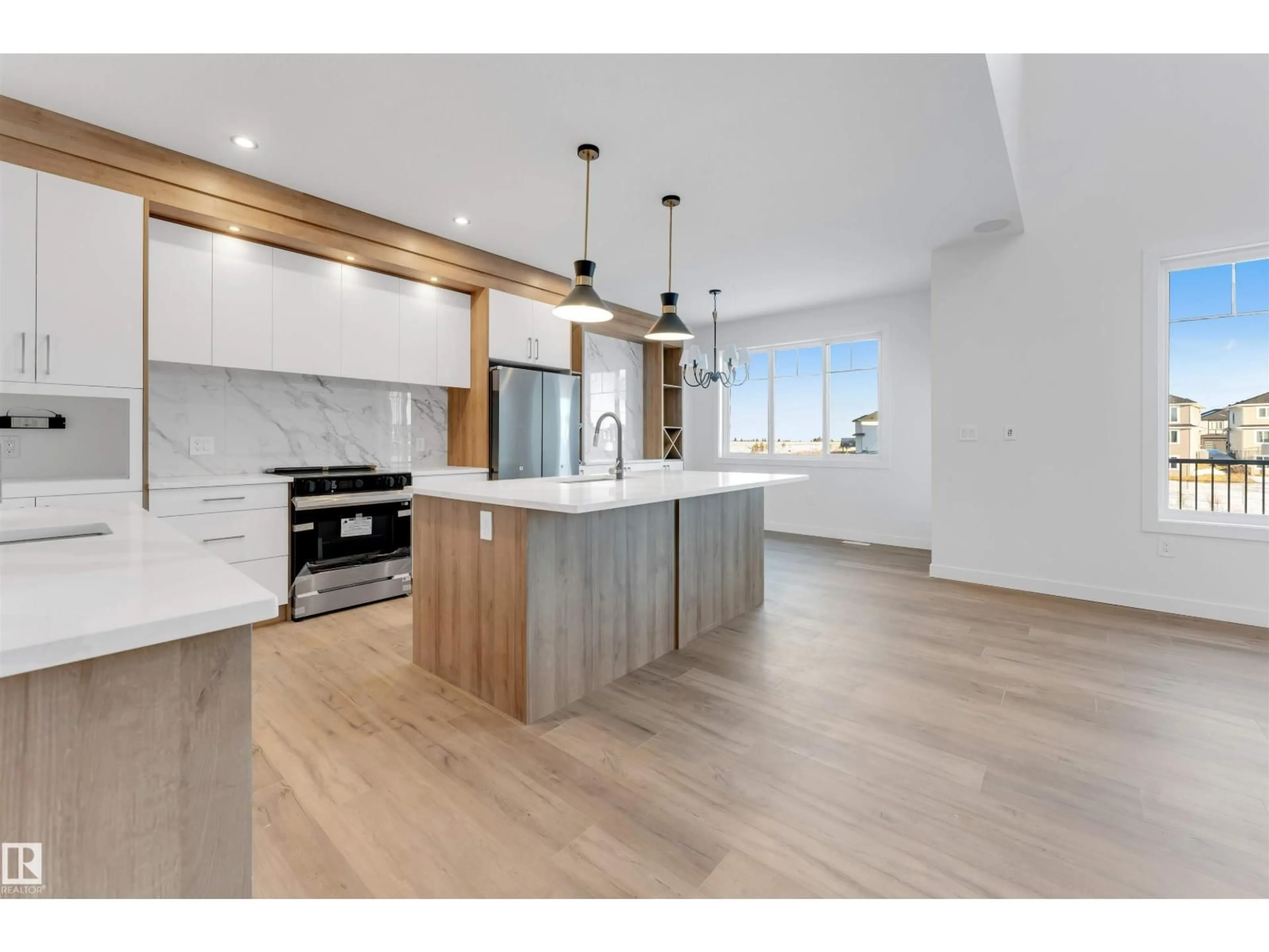 Open concept kitchen, wood/laminate floor for 17 AXELWOOD CR, Spruce Grove Alberta T7X0Y3