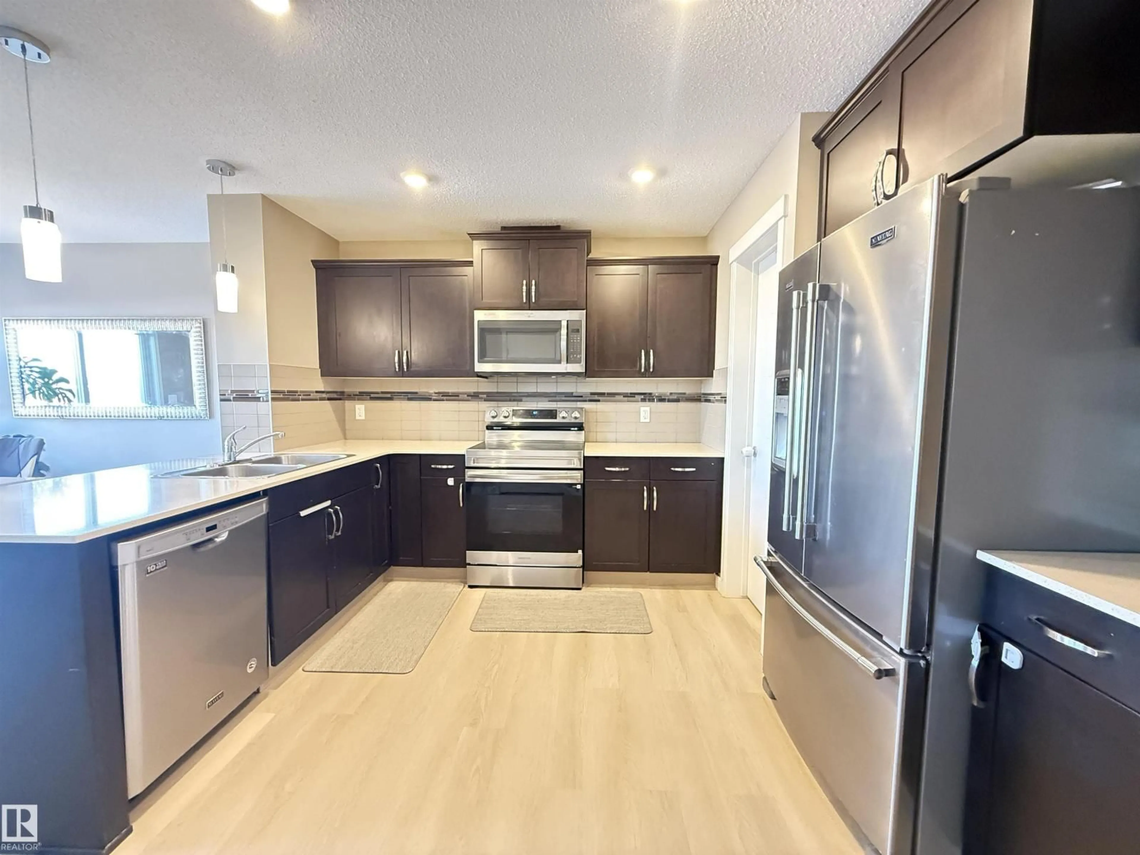 Open concept kitchen, ceramic/tile floor for NW - 17633 120 ST, Edmonton Alberta T5X0K8