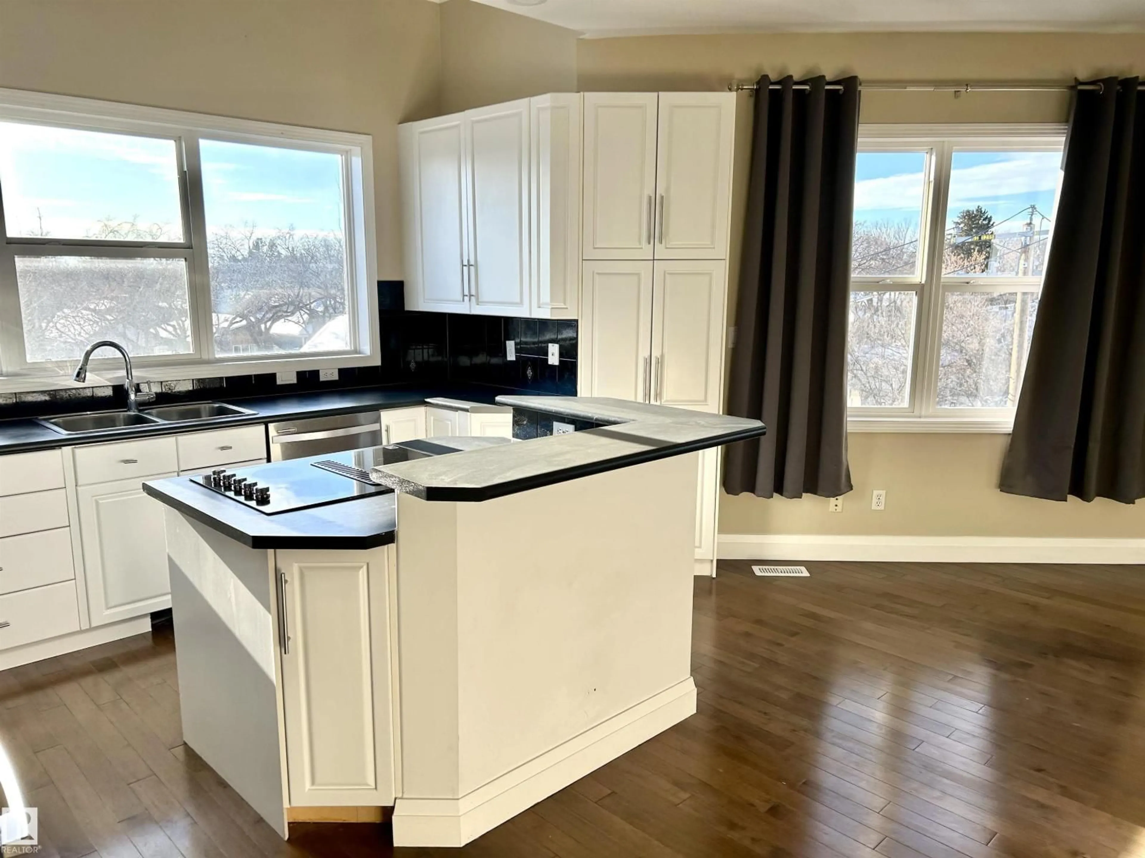 Open concept kitchen, wood/laminate floor for #213 - 10939 82 AV, Edmonton Alberta T6G0S7