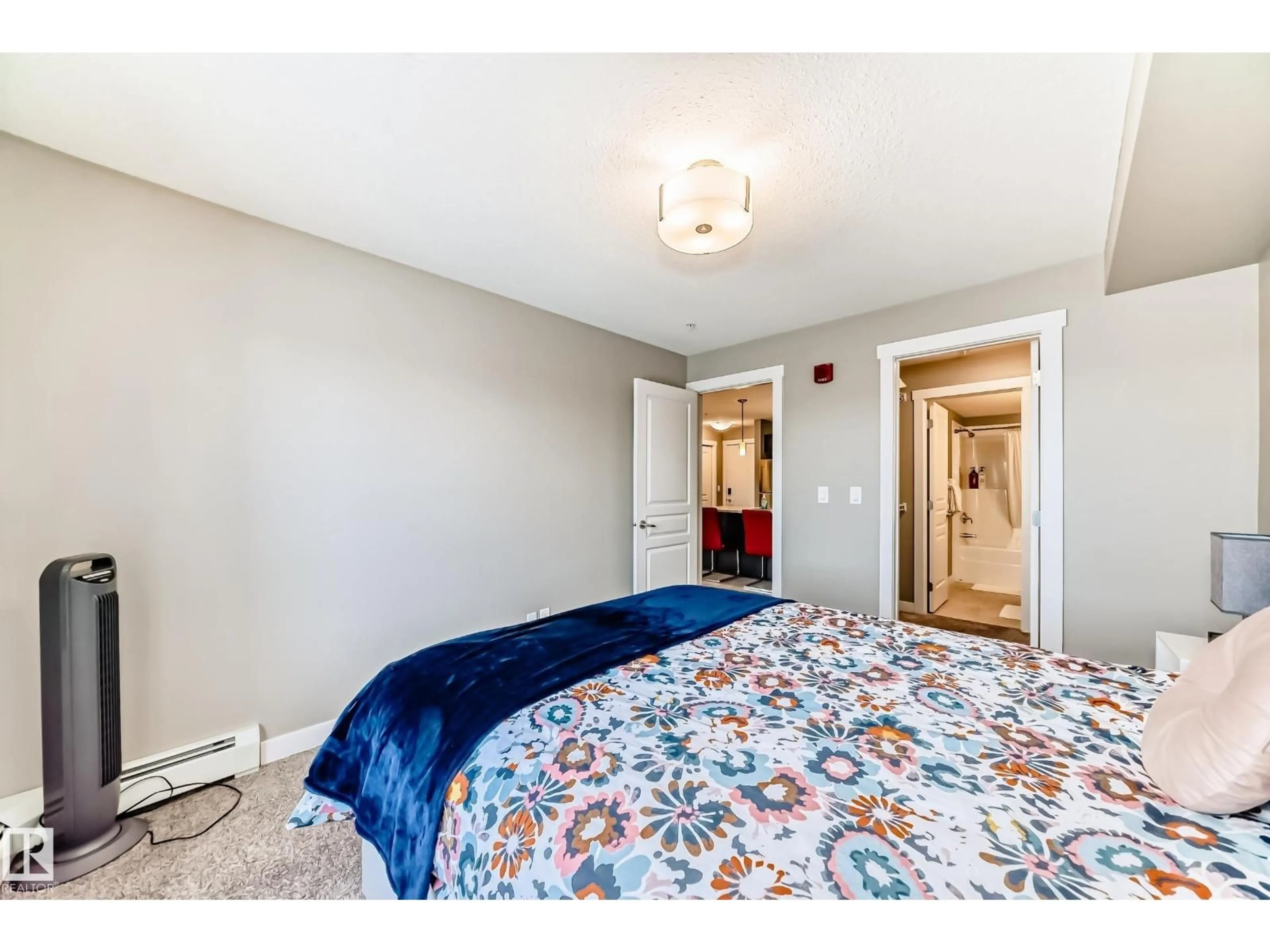 Bedroom with bed, carpet floor for #217 - 3670 139 AV, Edmonton Alberta T5Y3N5