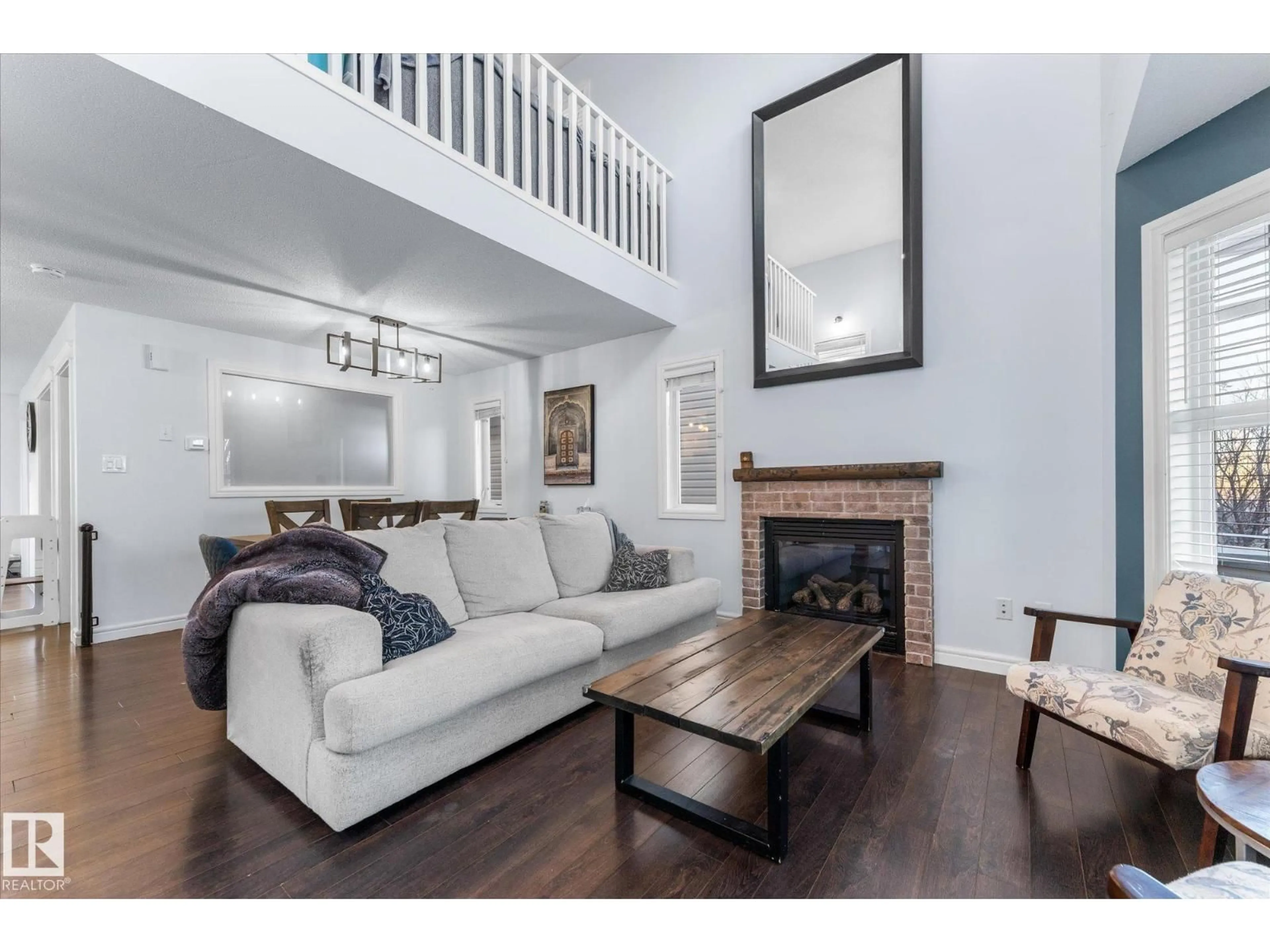 Living room with furniture, wood/laminate floor for 35 SPRUCE VILLAGE DR, Spruce Grove Alberta T7X0H2