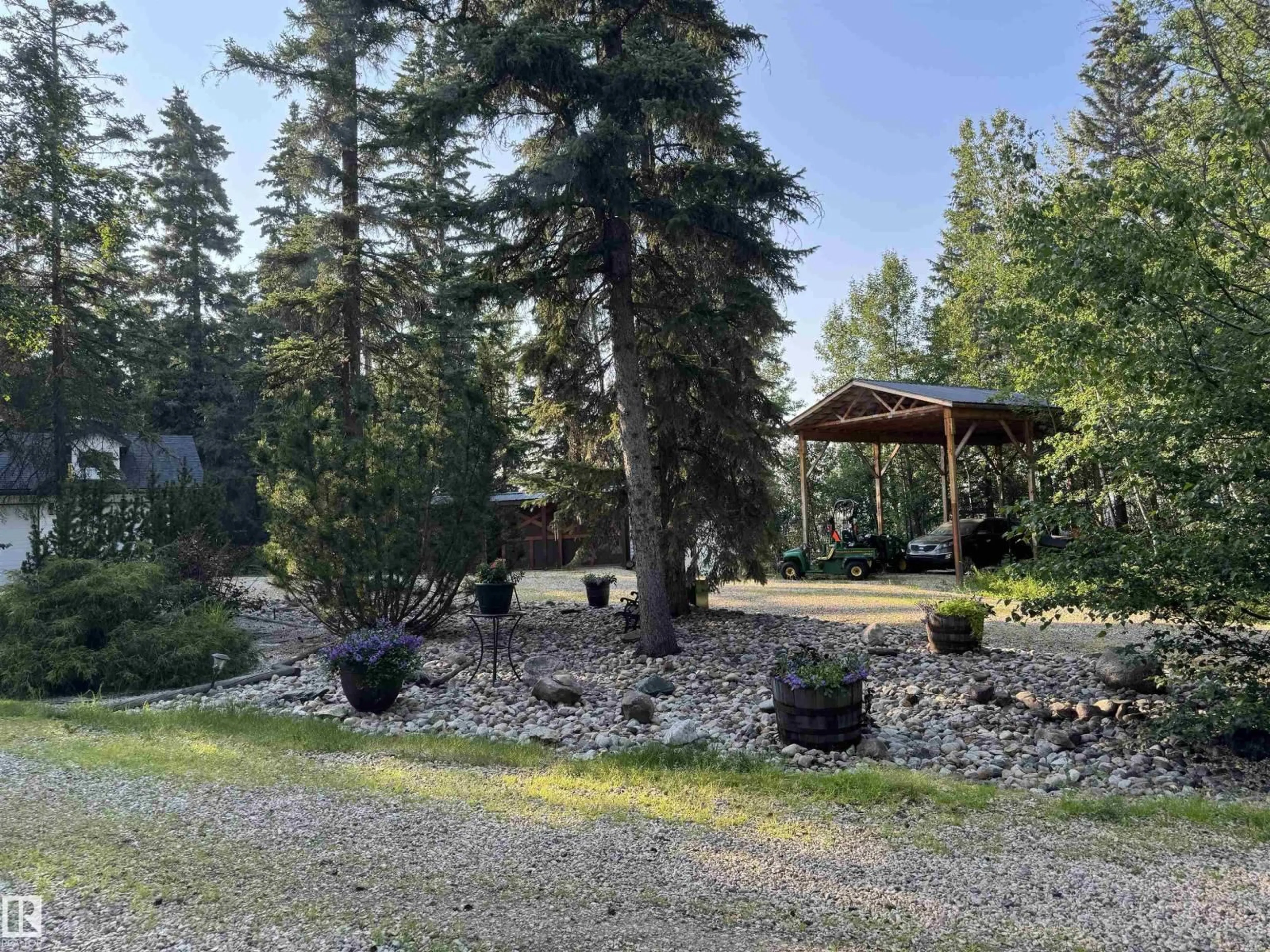 A pic from outside/outdoor area/front of a property/back of a property/a pic from drone, forest/trees view for 60330 RGE RD 40, Rural Barrhead County Alberta T7N1N2