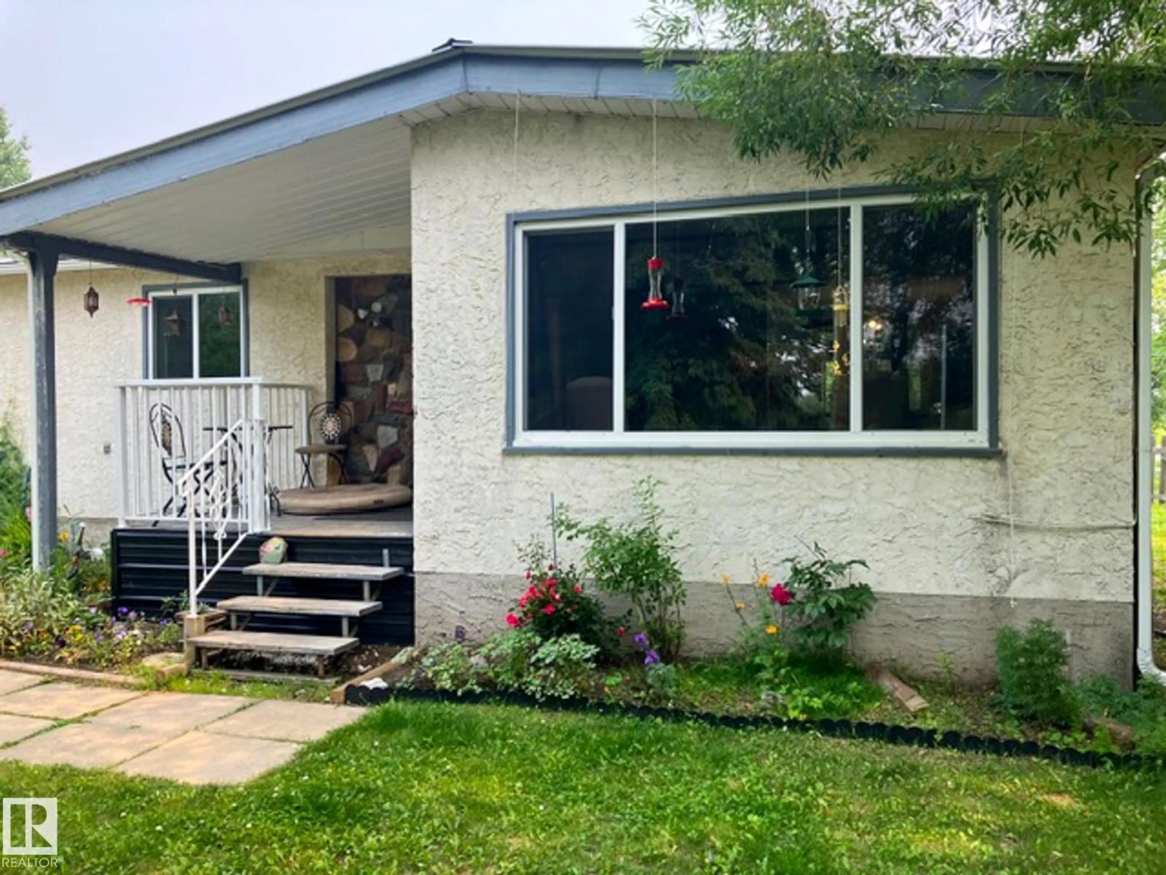 Home with vinyl exterior material, street for 461039 RGE ROAD 282, Rural Wetaskiwin County Alberta T0C2V0