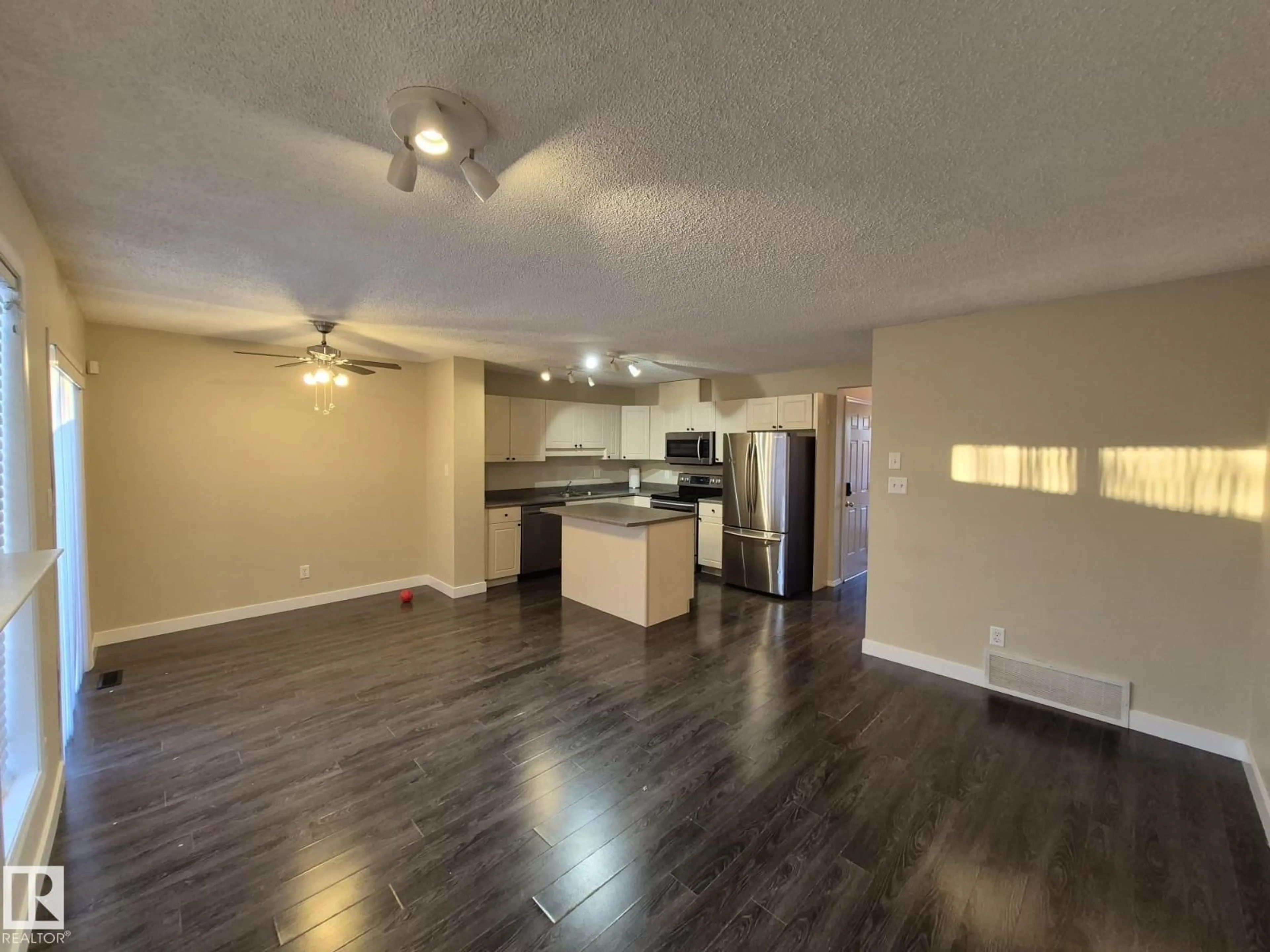 Open concept kitchen, wood/laminate floor for 2965 23 ST, Edmonton Alberta T6T2B3
