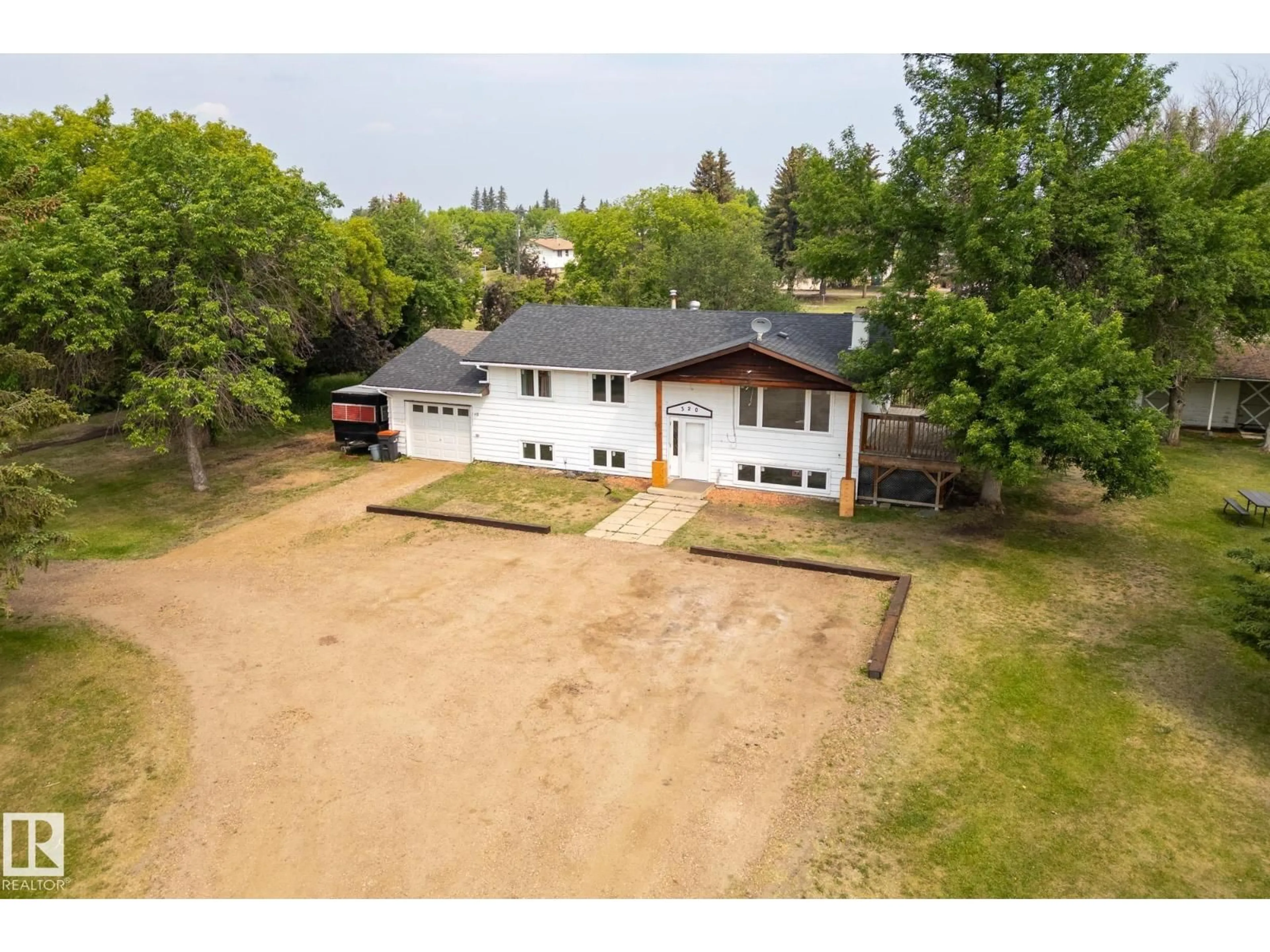 A pic from outside/outdoor area/front of a property/back of a property/a pic from drone, street for 320 1 AV, Thorhild Alberta T0A3J0