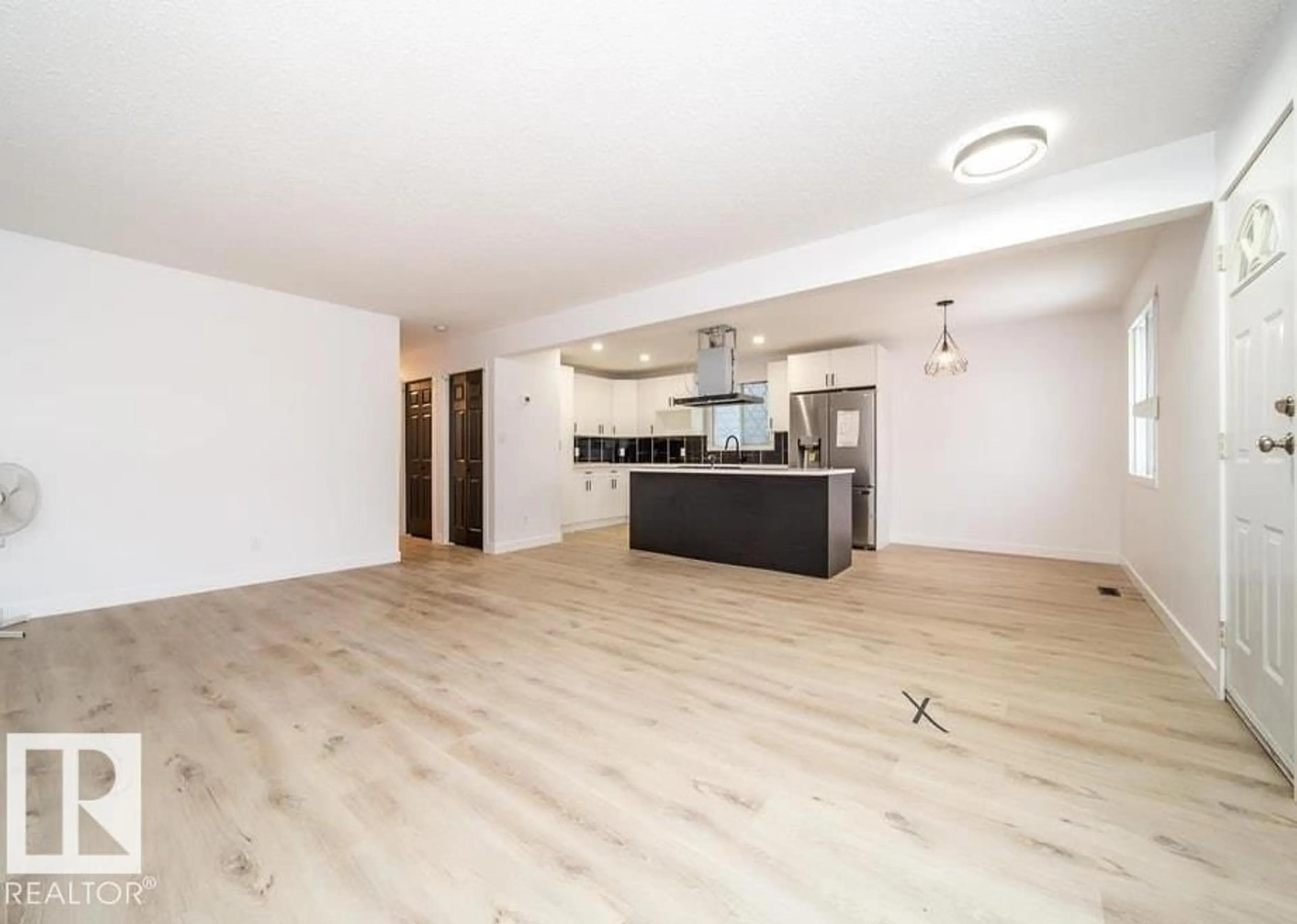 Open concept kitchen, wood/laminate floor for NW - 11523 82 ST, Edmonton Alberta T5B2V7