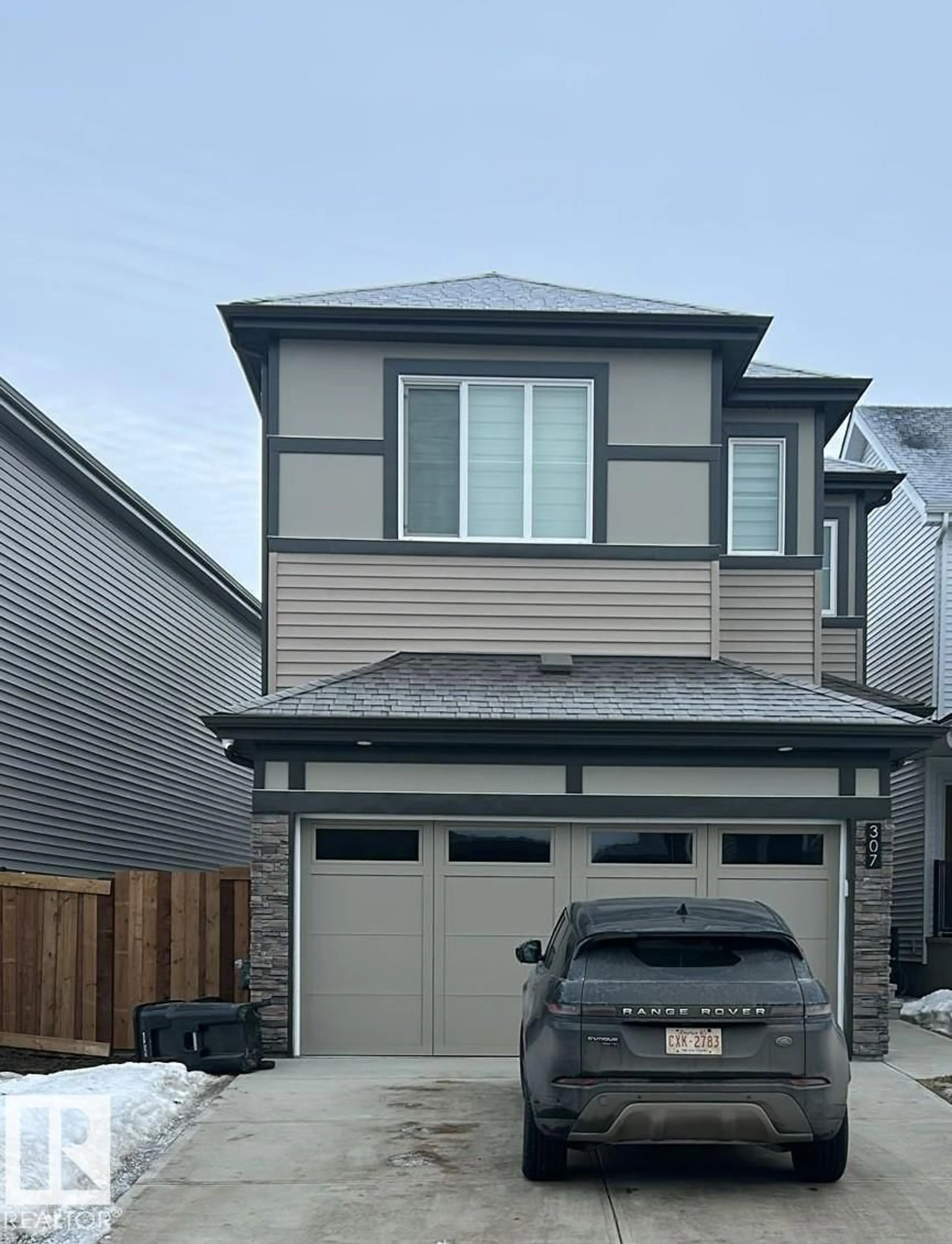 Home with vinyl exterior material, street for 307 28 ST, Edmonton Alberta T6X3E7