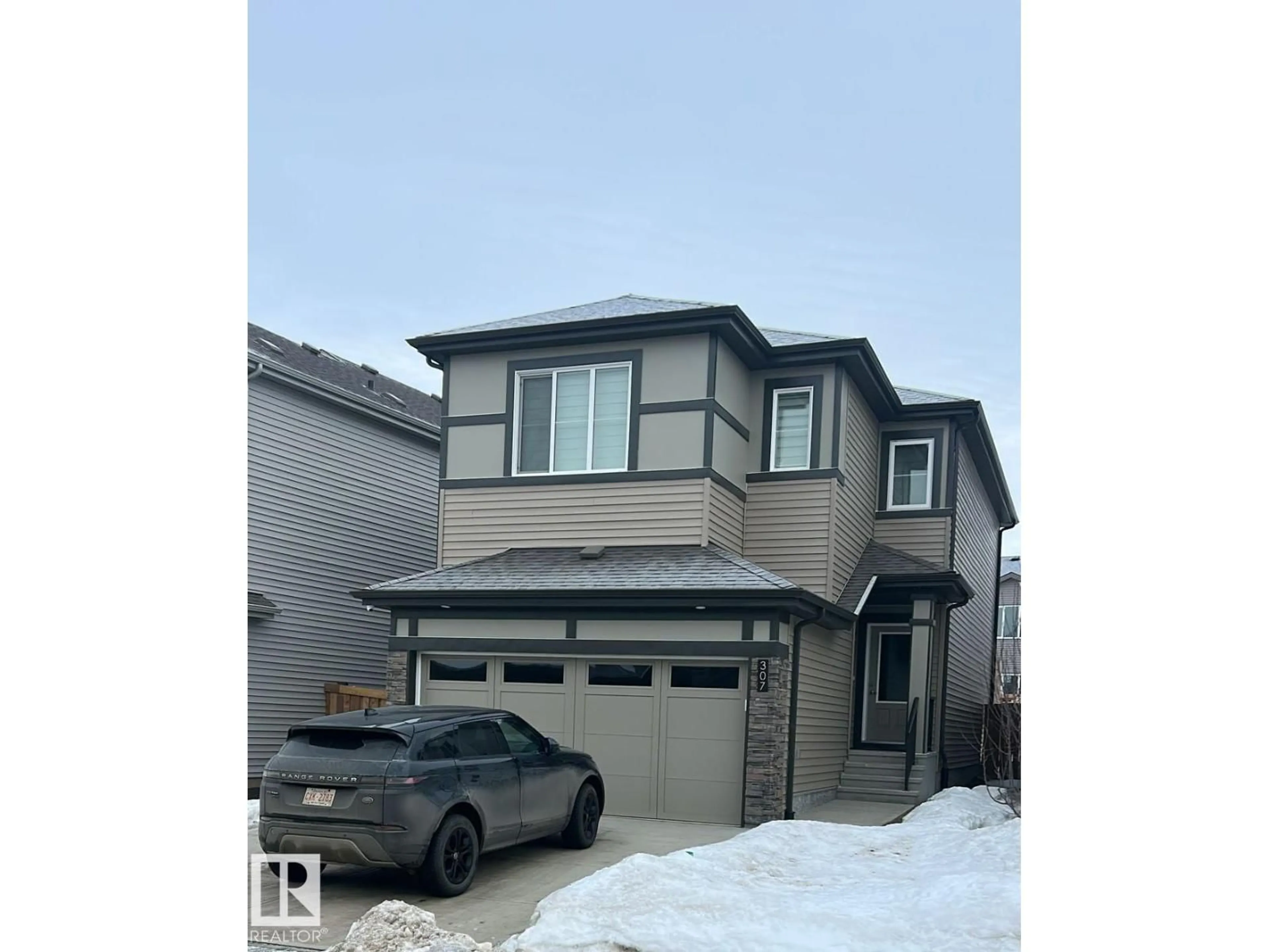 Home with vinyl exterior material, street for 307 28 ST, Edmonton Alberta T6X3E7
