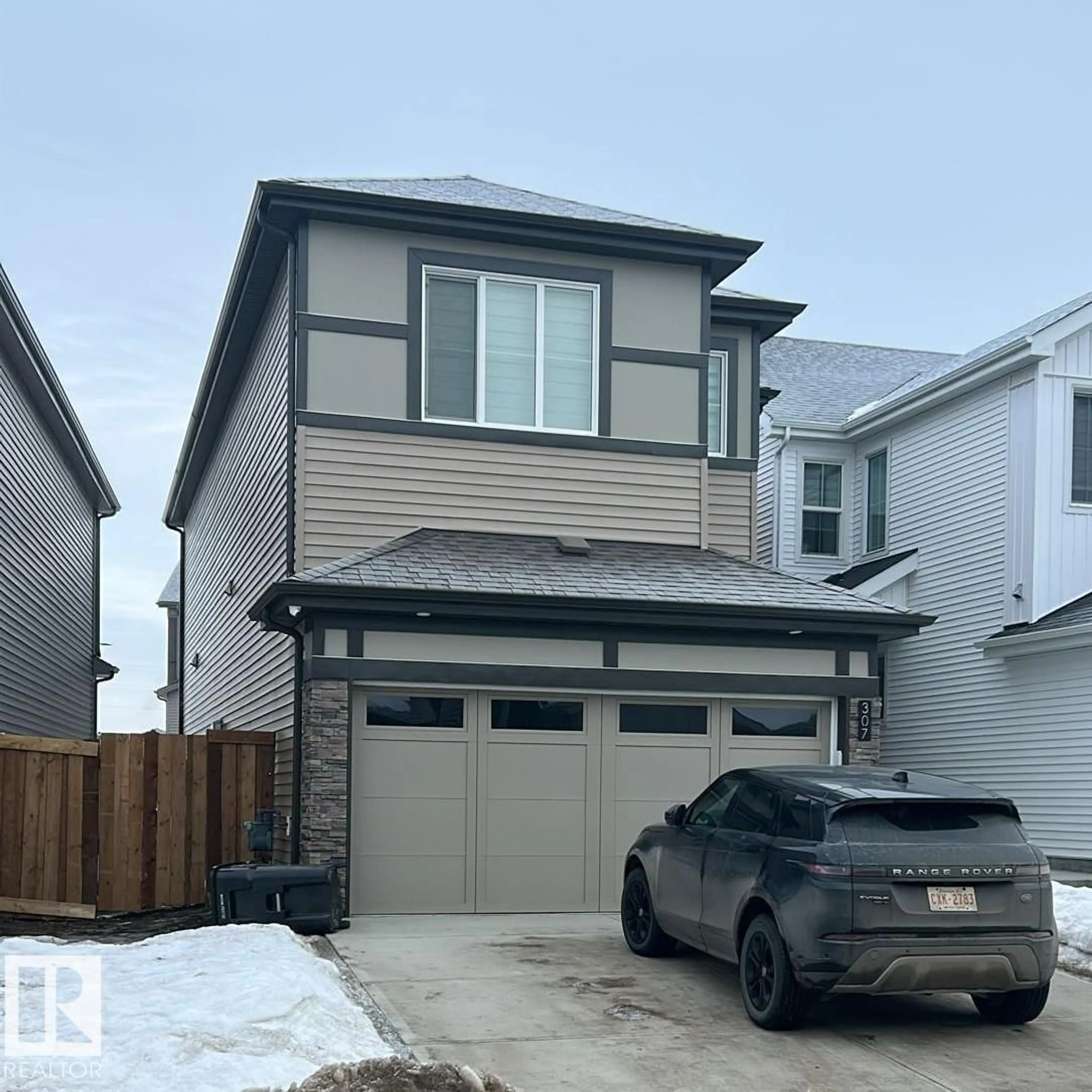 Home with vinyl exterior material, street for 307 28 ST, Edmonton Alberta T6X3E7