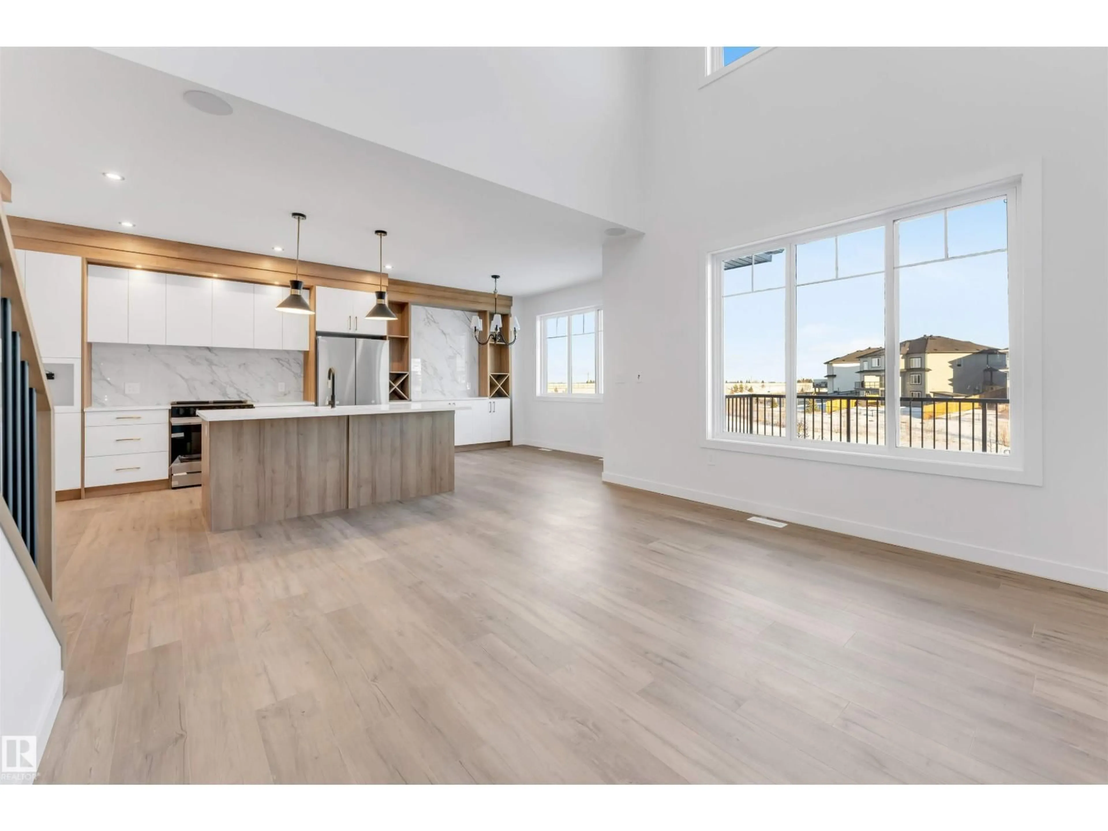 Open concept kitchen, wood/laminate floor for 8 MEADOWGROVE LD, Spruce Grove Alberta T7X0W2