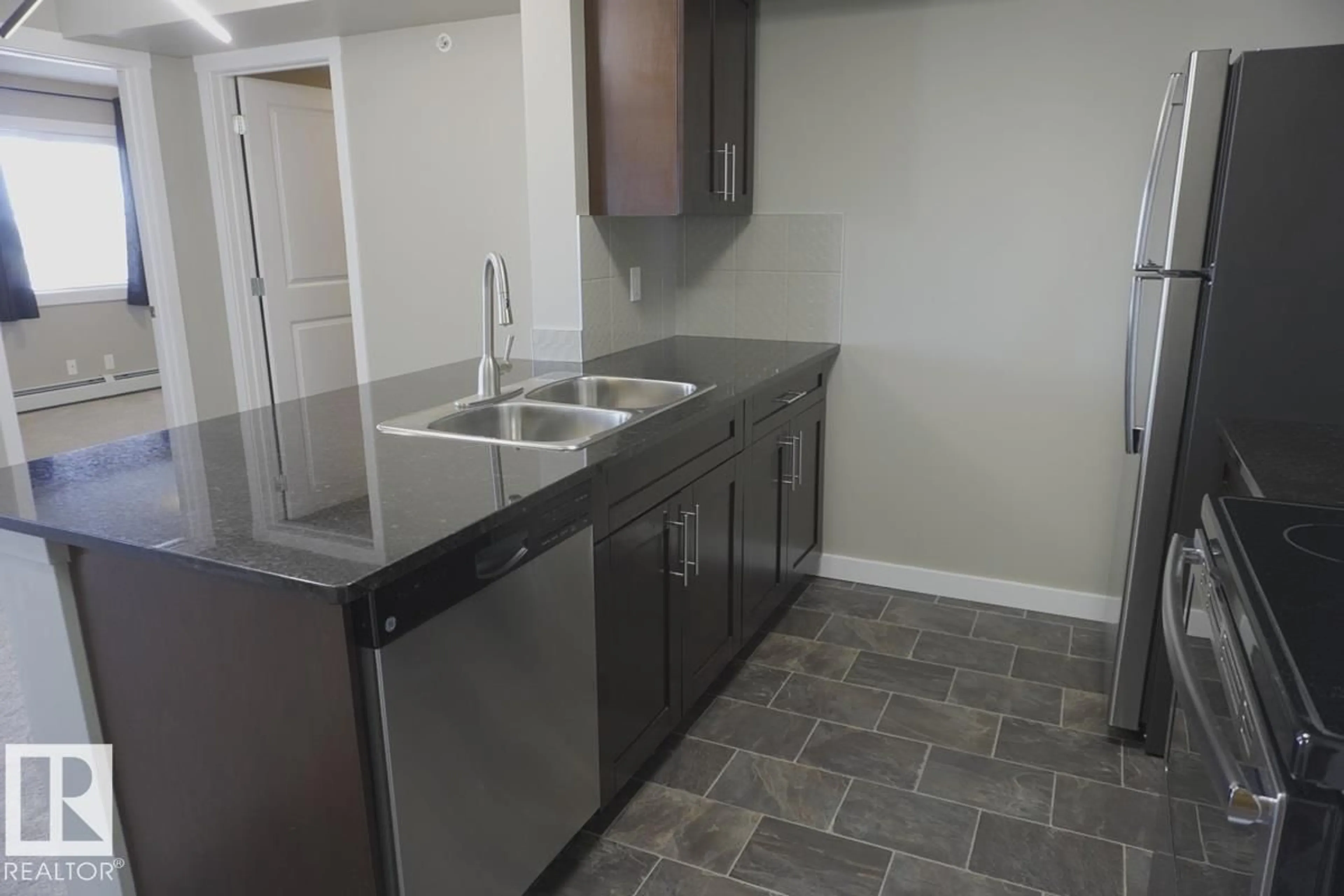 Standard kitchen, unknown for #409 - 5810 MULLEN PL, Edmonton Alberta T6R0W3