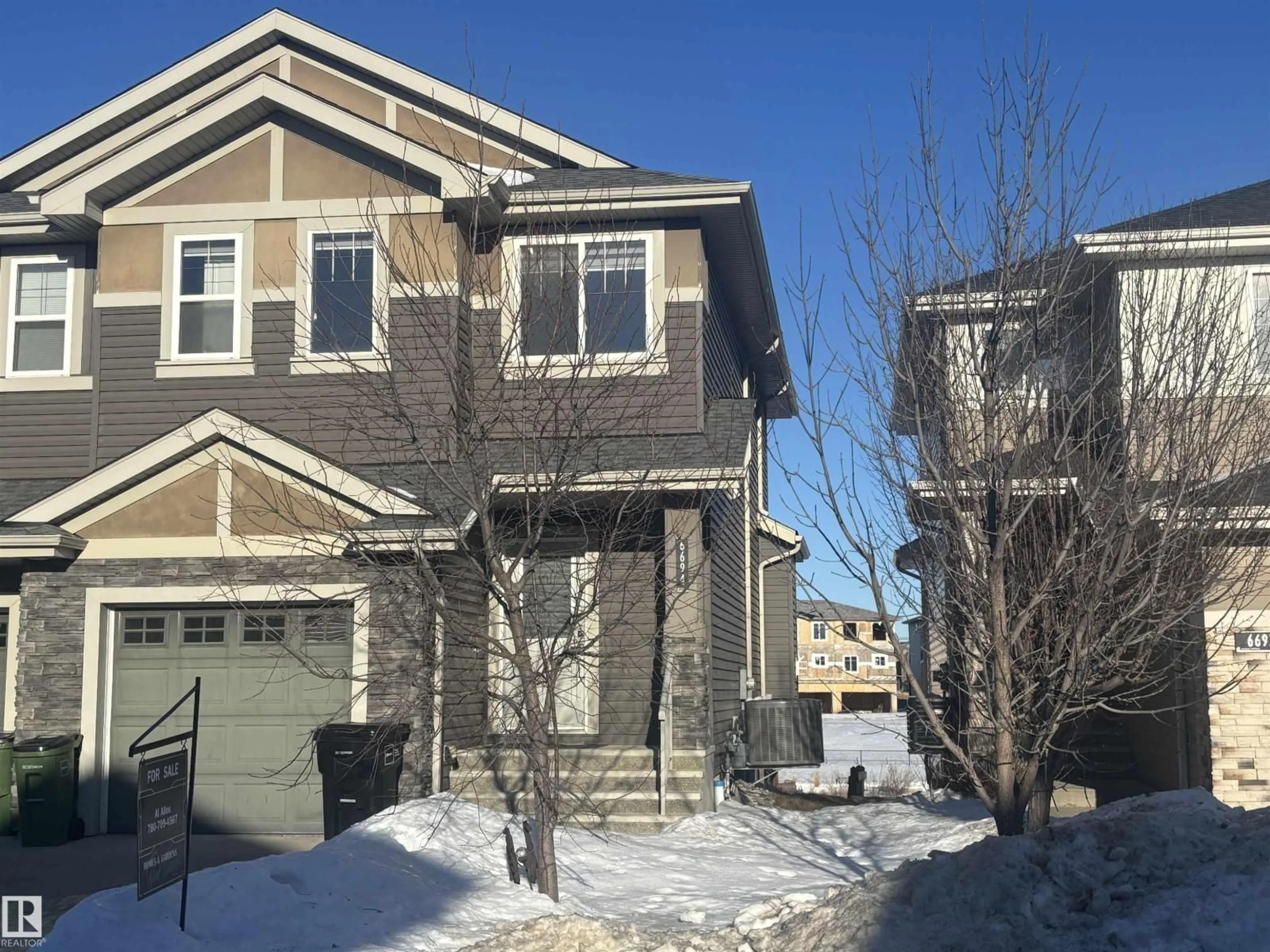 Home with vinyl exterior material, street for 6694 CARDINAL RD, Edmonton Alberta T6W2Y4