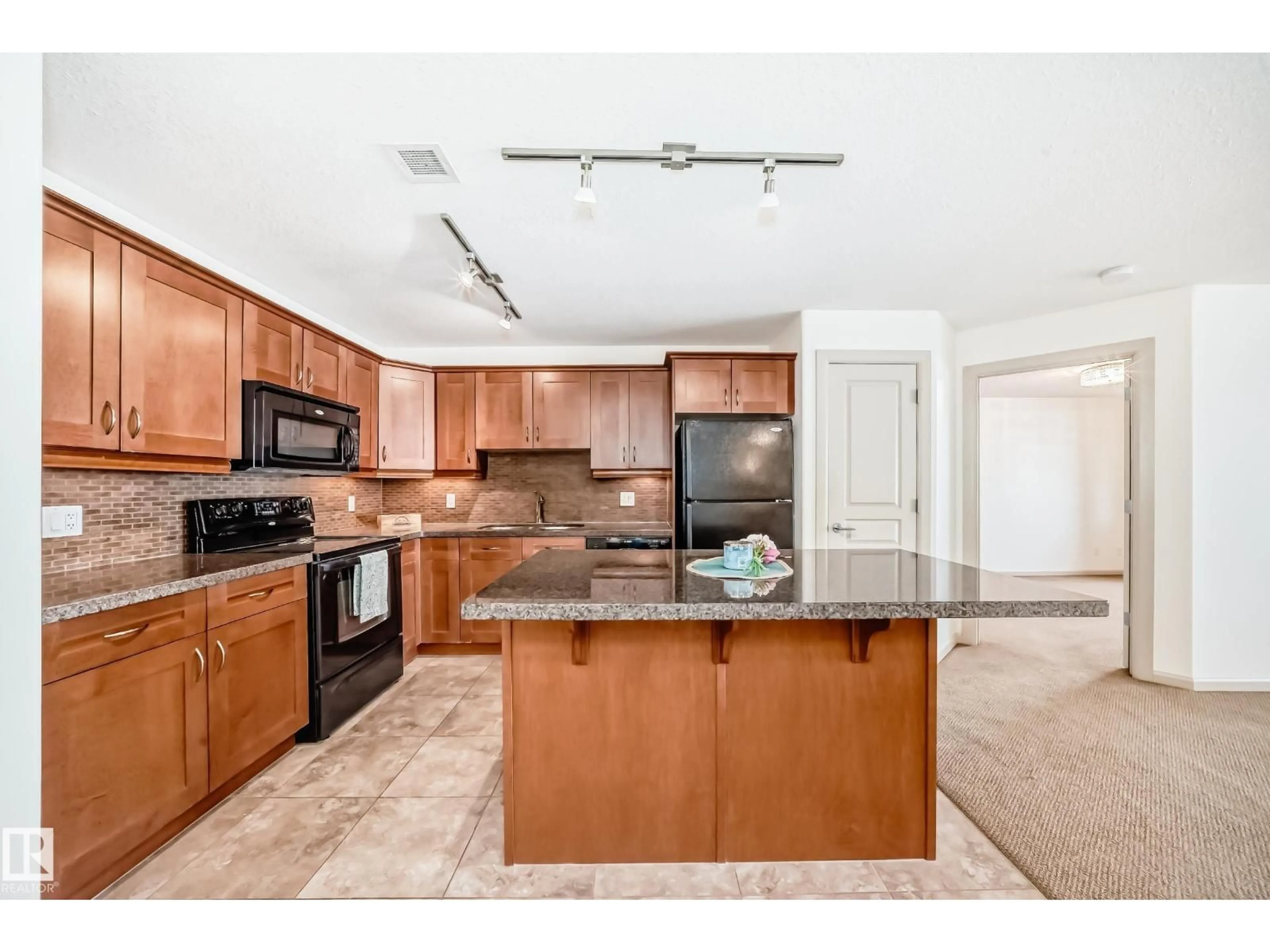 Open concept kitchen, ceramic/tile floor for 400 - 119 PALISADES WY, Sherwood Park Alberta T8A0H4