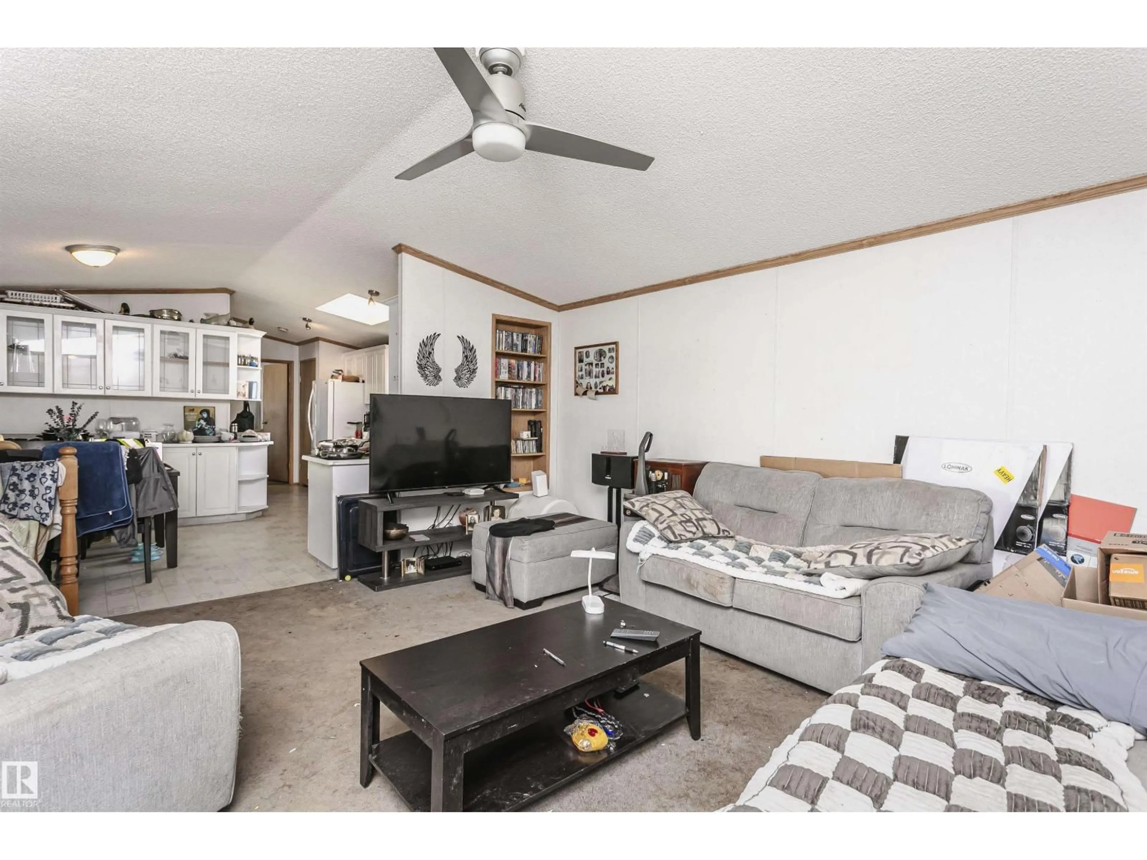 Living room with furniture, wood/laminate floor for 2964 LAKEWOOD DR, Edmonton Alberta T5S1T7