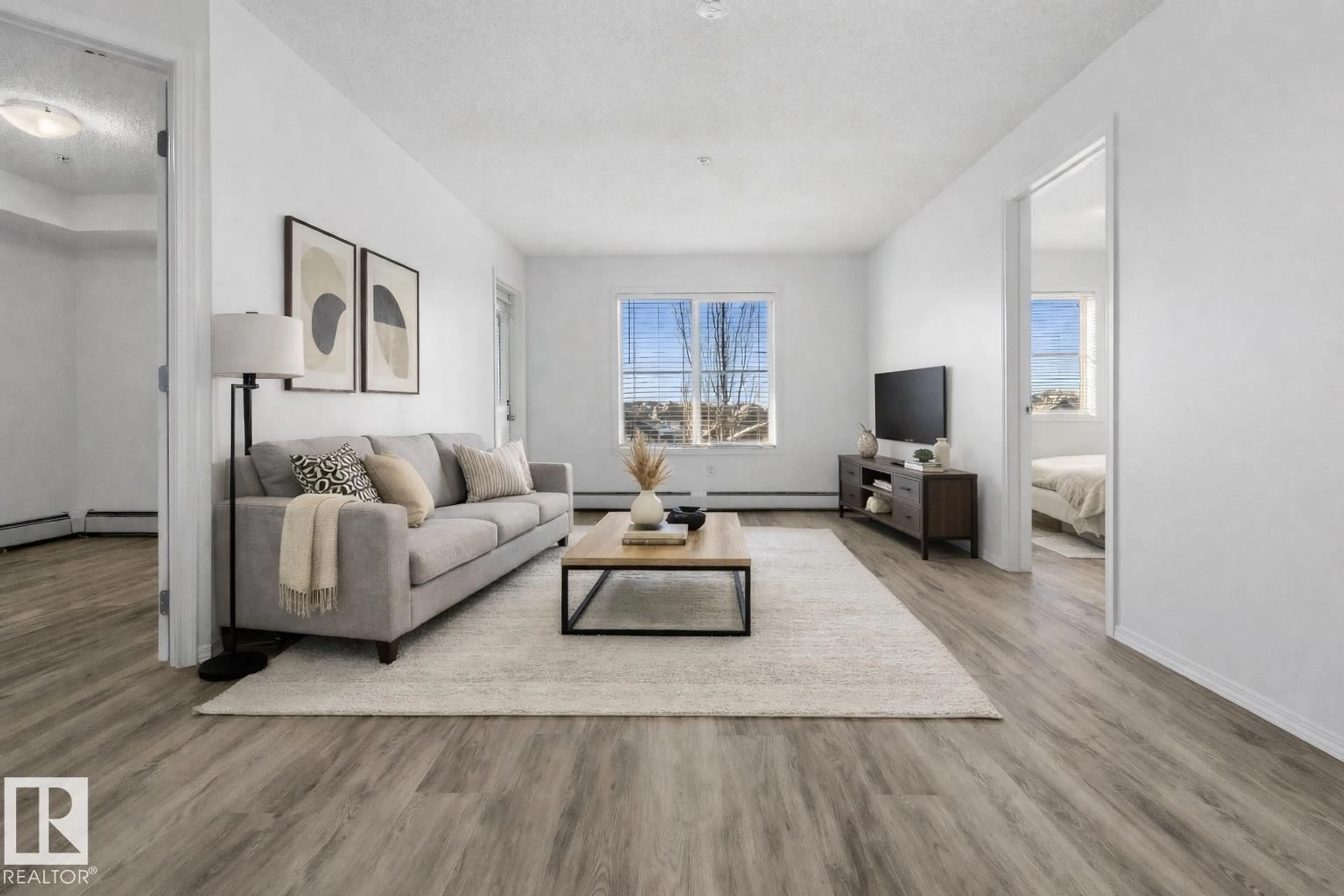 Living room with furniture, unknown for #313 - 270 MCCONACHIE DR, Edmonton Alberta T5Y3N4