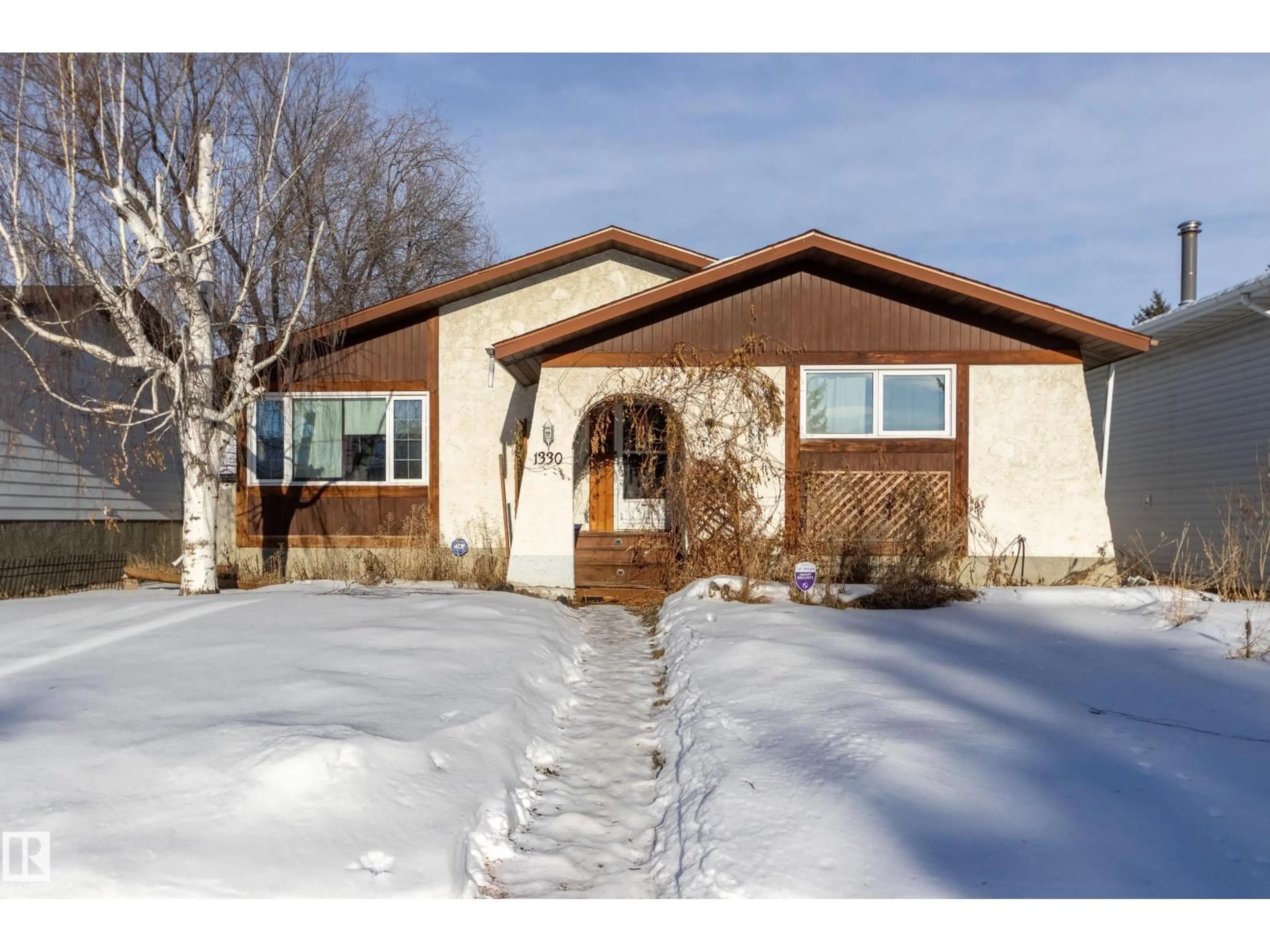 Home with vinyl exterior material, street for NW - 1330 72 ST, Edmonton Alberta T6K2S9