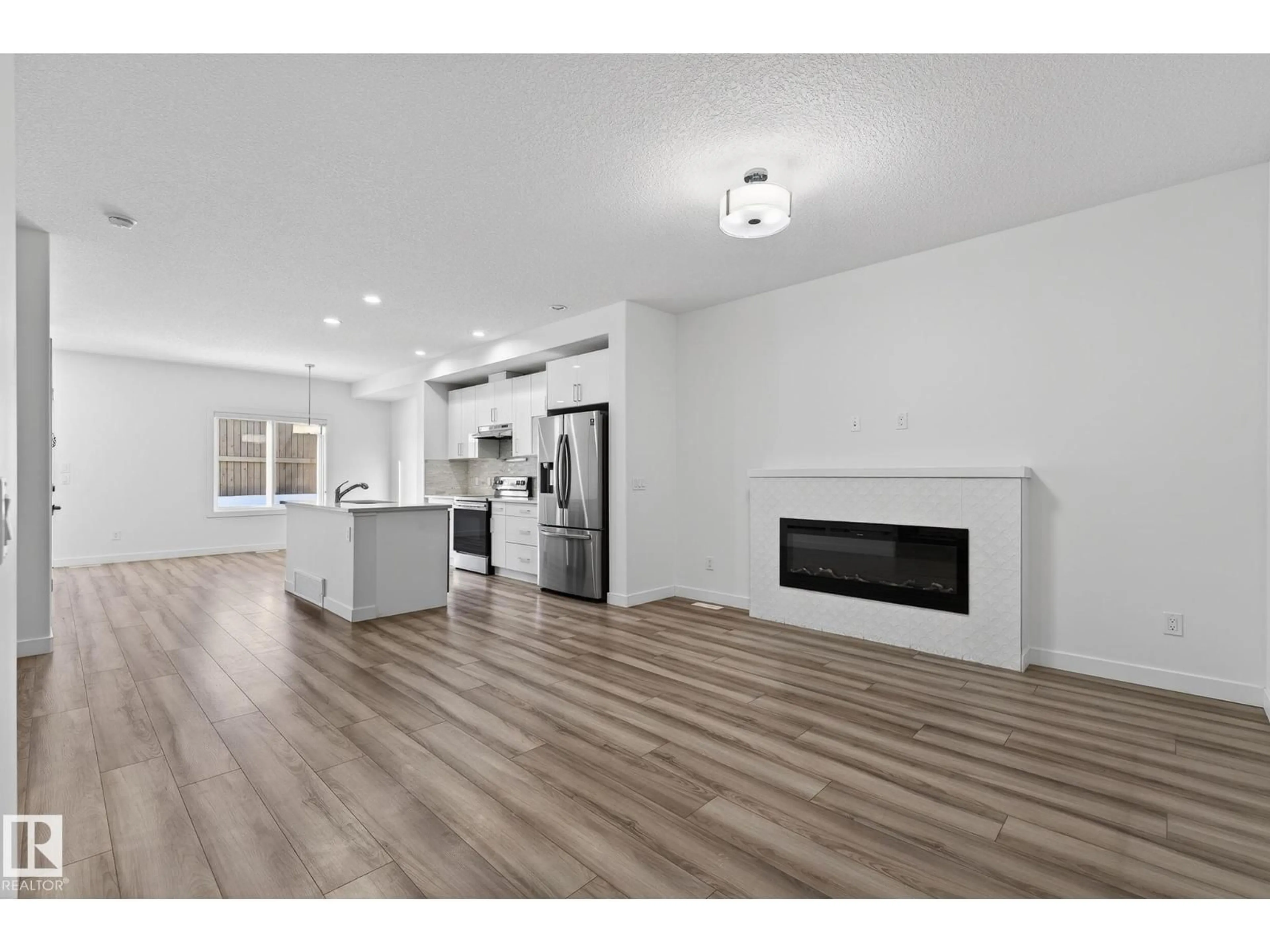 Open concept kitchen, wood/laminate floor for 4851 ALWOOD PT, Edmonton Alberta T6W4N1