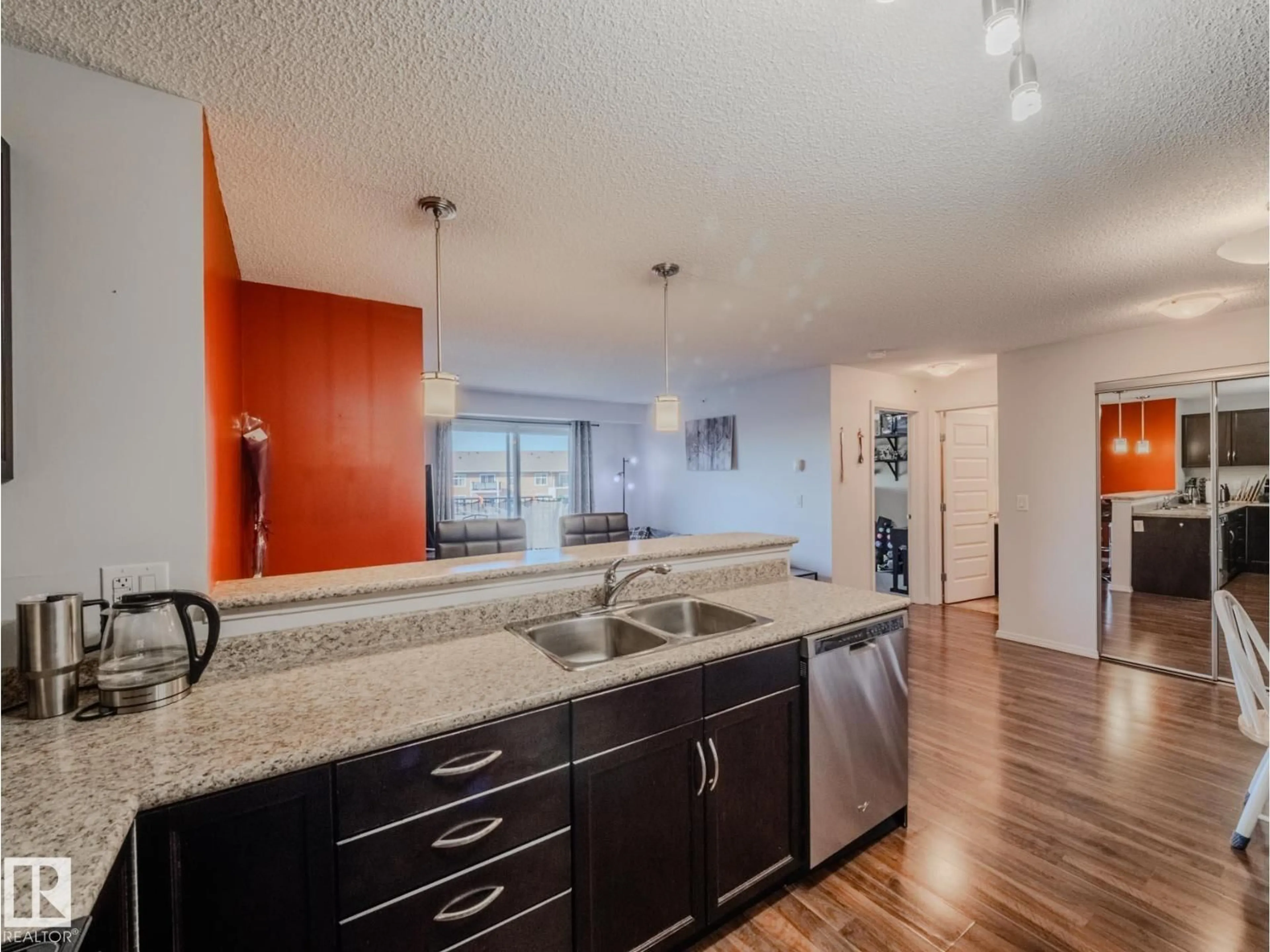 Open concept kitchen, unknown for #409 - 6070 SCHONSEE WY, Edmonton Alberta T5Z0G8