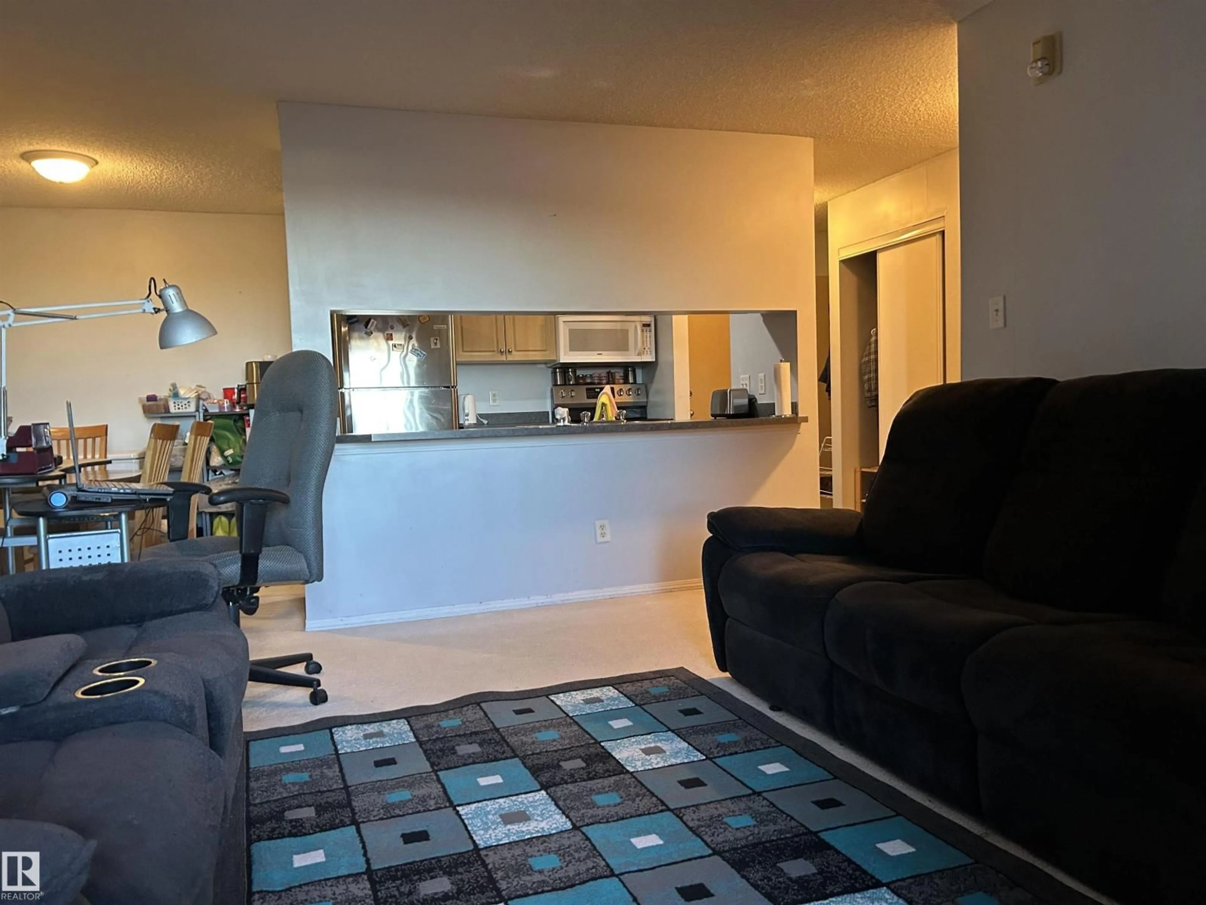 Living room with furniture, unknown for #310 - 2430 GUARDIAN RD, Edmonton Alberta T5T6X9