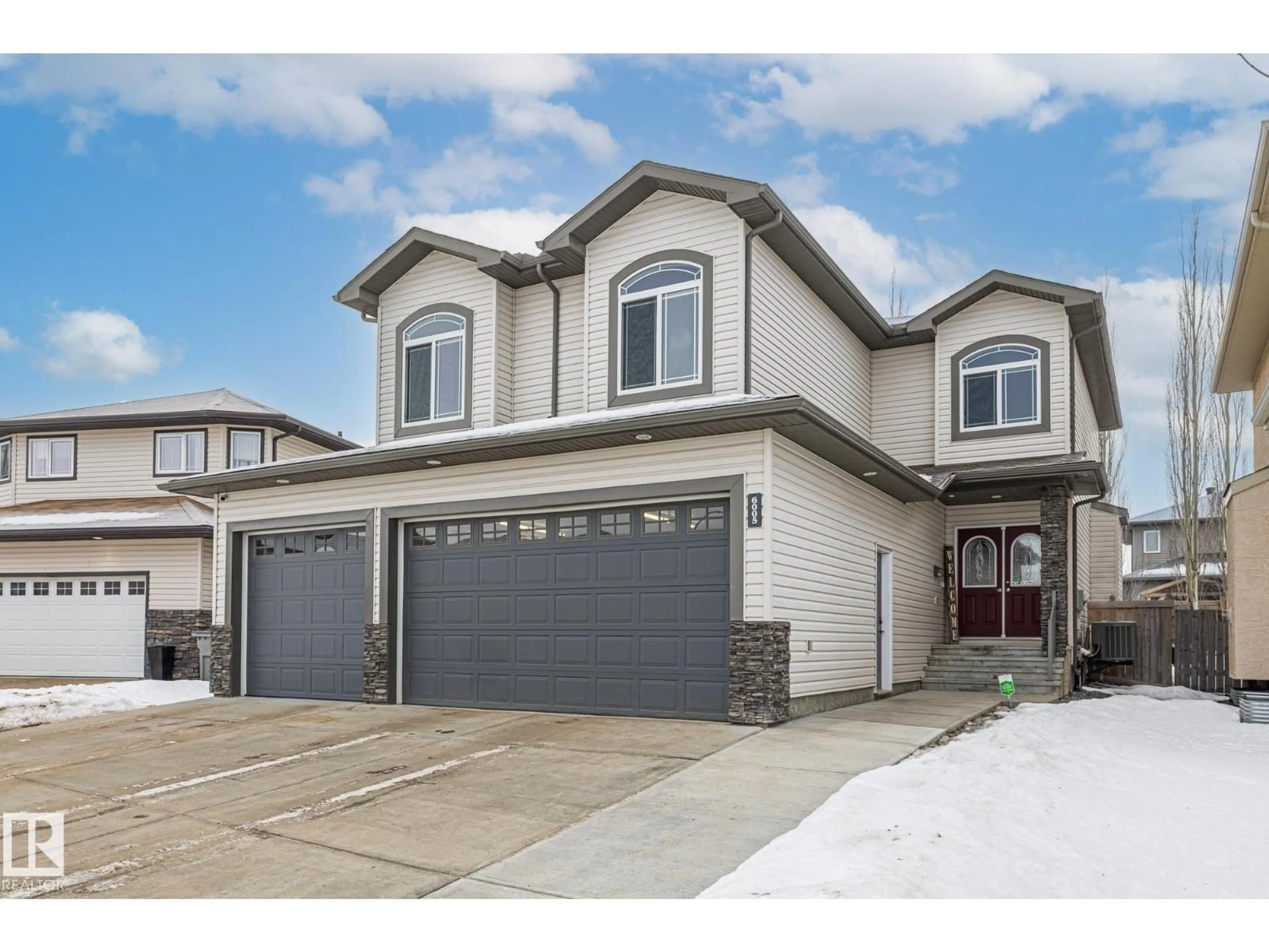 Home with vinyl exterior material, street for NW - 6005 56 AV, Beaumont Alberta T4X0G8