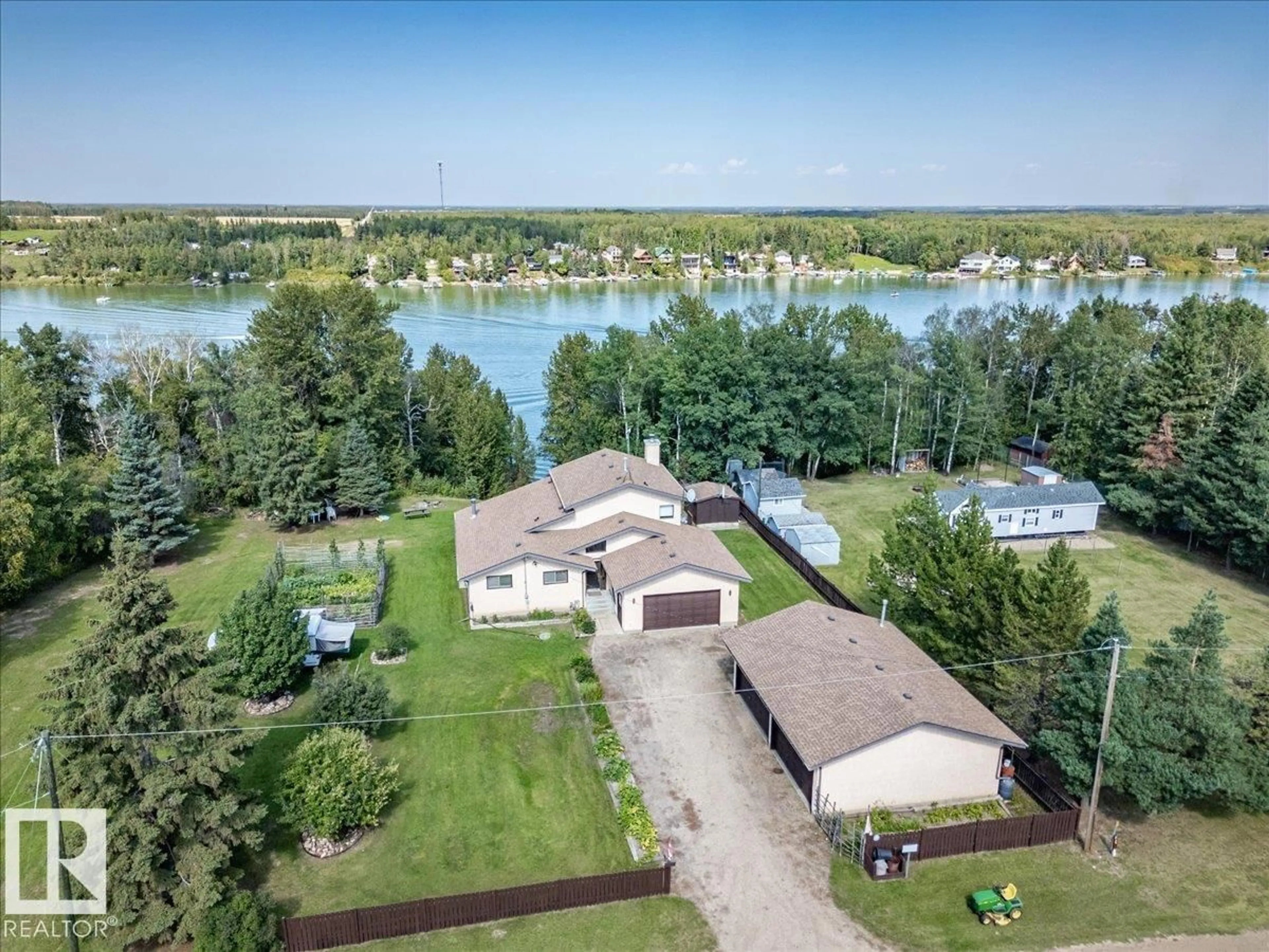 A pic from outside/outdoor area/front of a property/back of a property/a pic from drone, water/lake/river/ocean view for 271022 TWP ROAD 480, Rural Wetaskiwin County Alberta T0C0V0