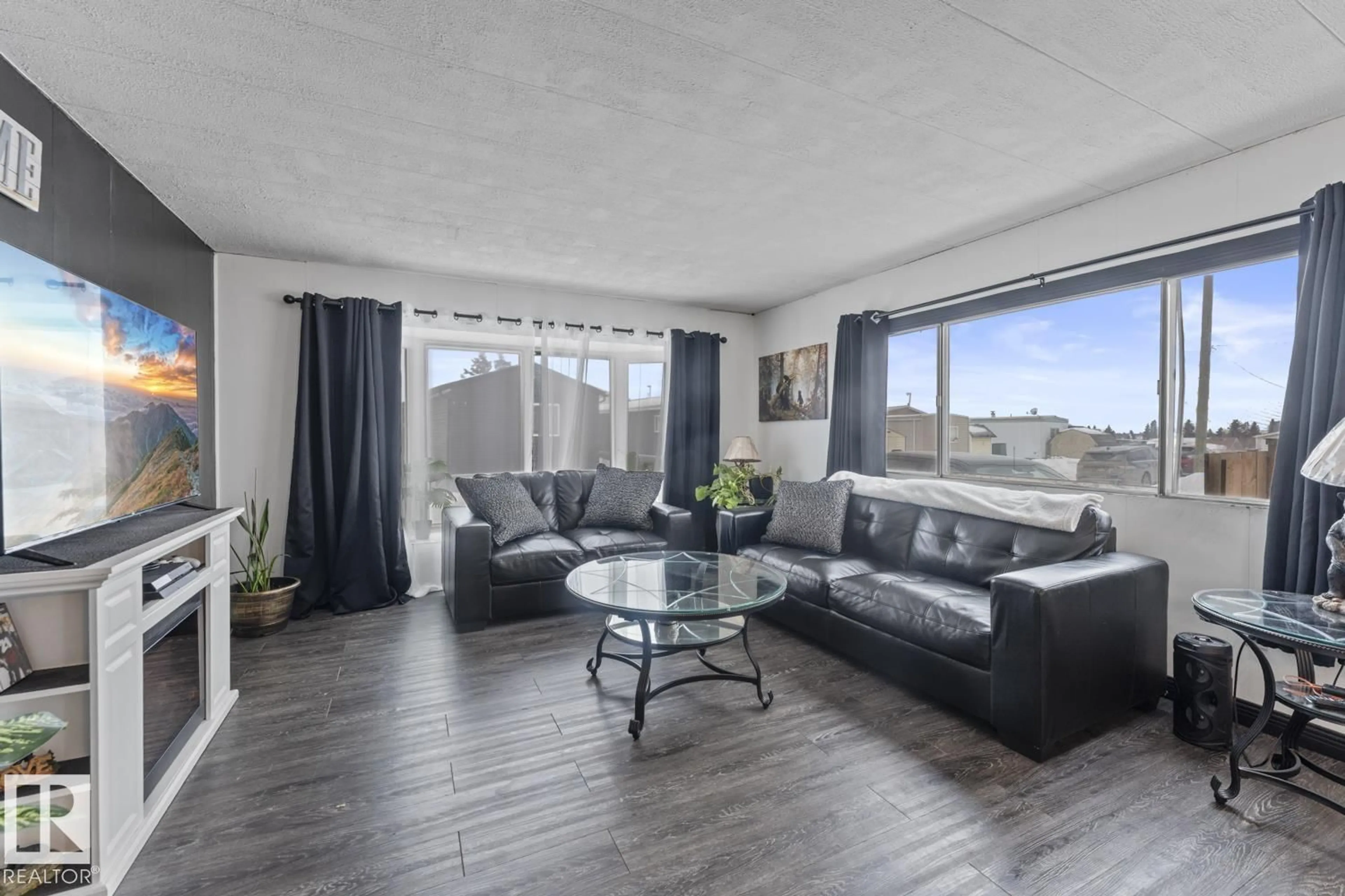 Living room with furniture, wood/laminate floor for 49 4405 50 AV, Cold Lake Alberta T9M1Z5