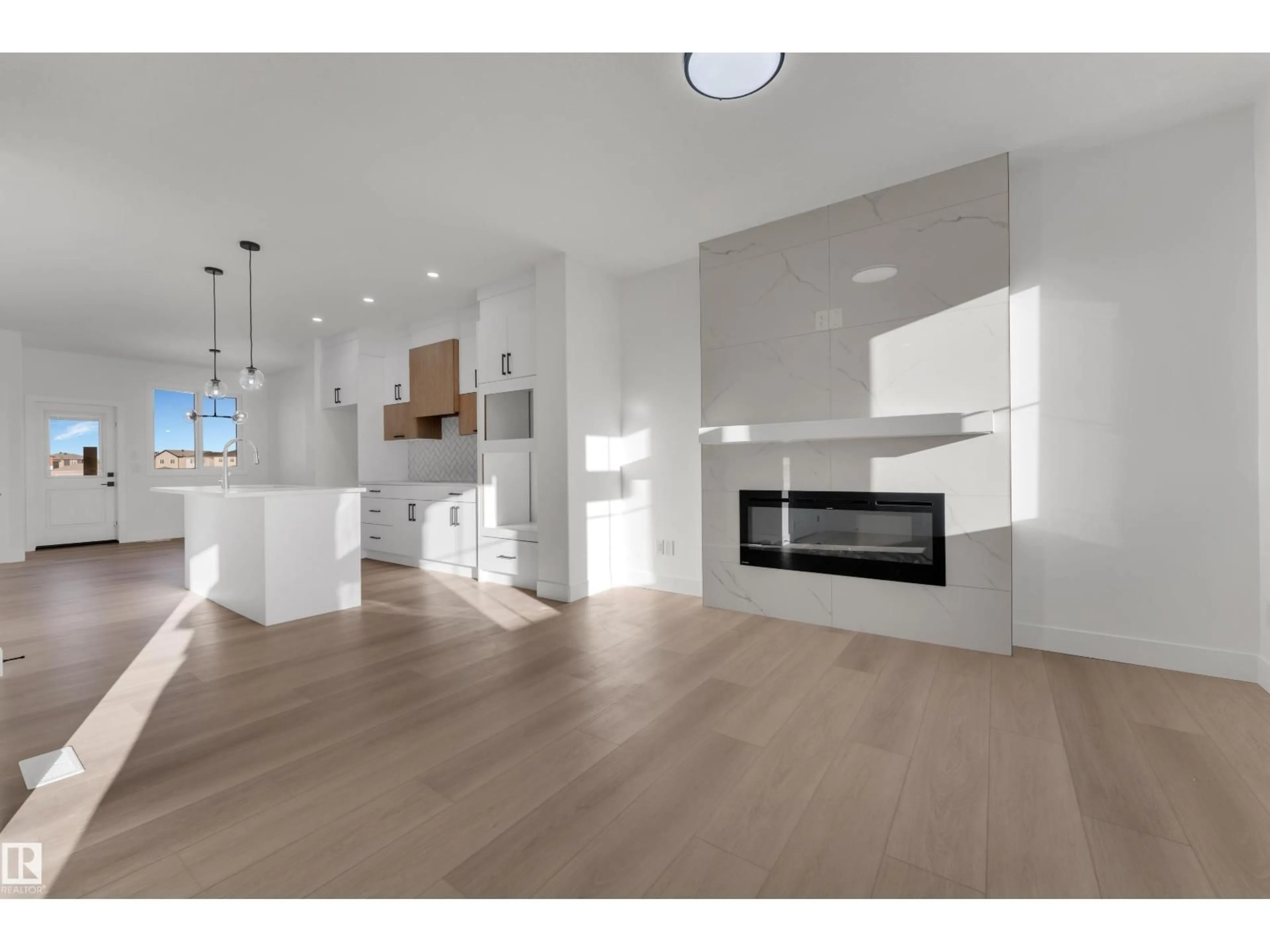 Open concept kitchen, wood/laminate floor for 281 MUNN WY, Leduc Alberta T9E1V1