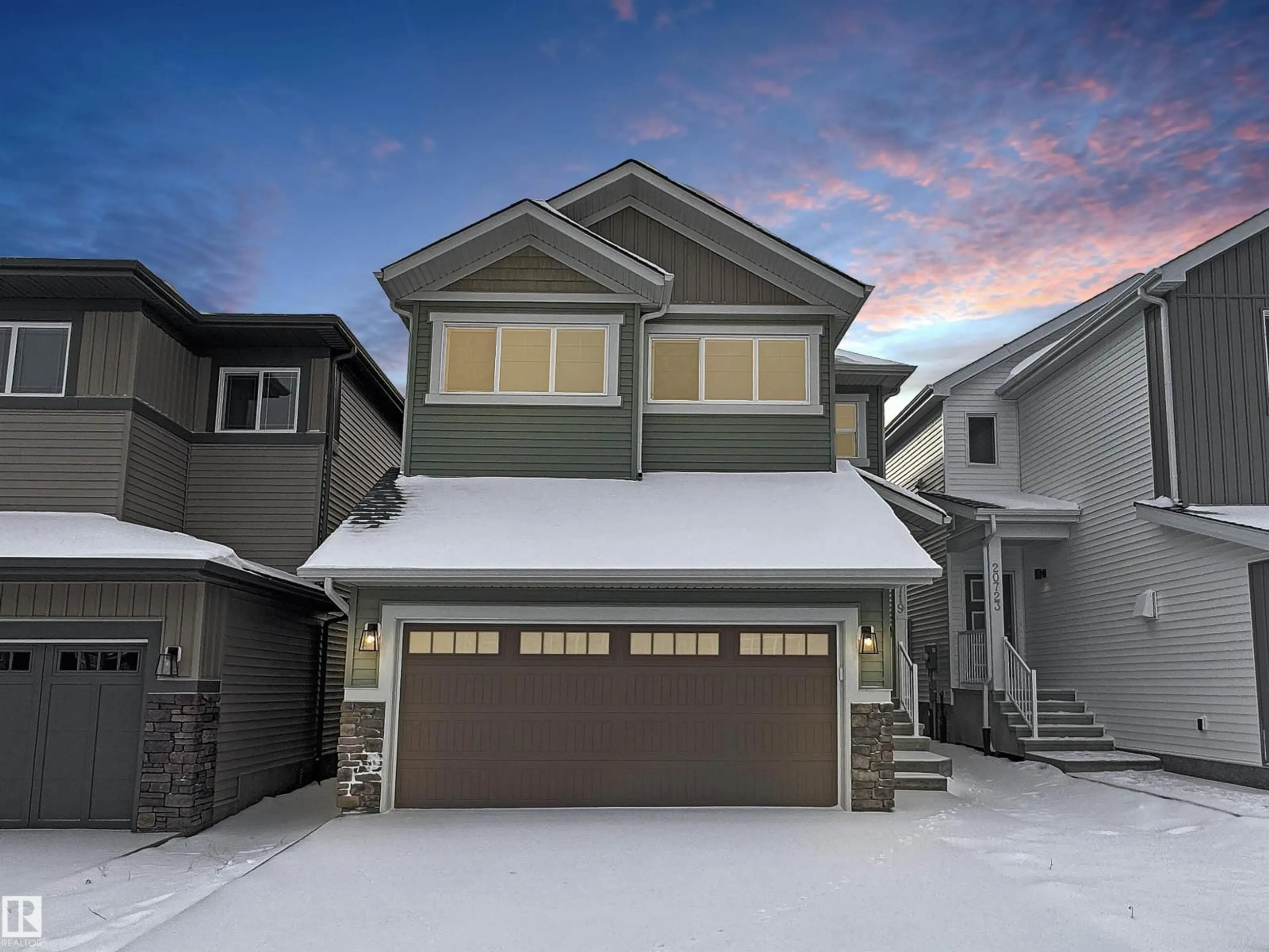 Home with vinyl exterior material, street for NW - 20719 24 AV, Edmonton Alberta T6M2C4