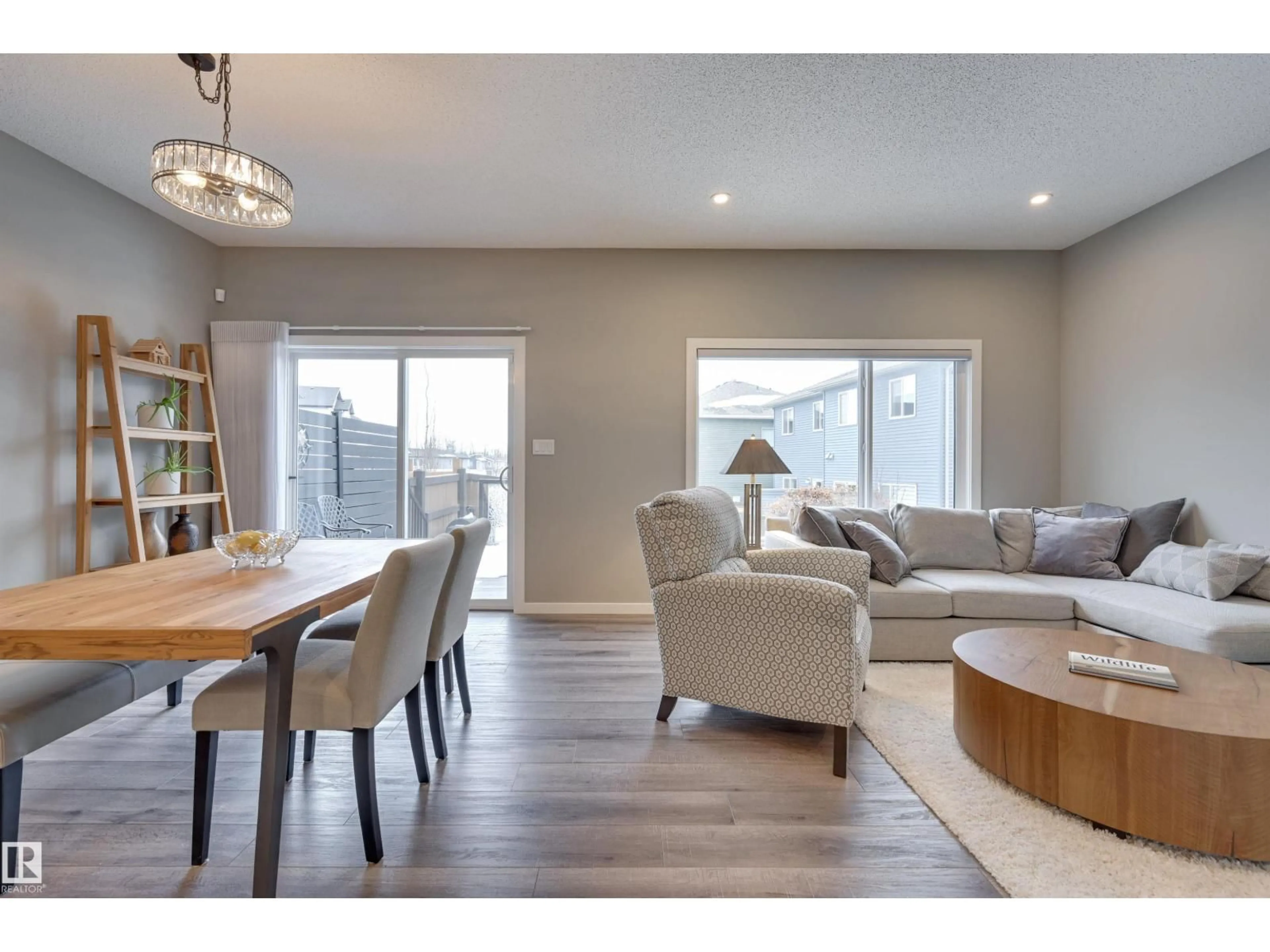 Living room with furniture, wood/laminate floor for 5158 LARK CR, Edmonton Alberta T5S0P2