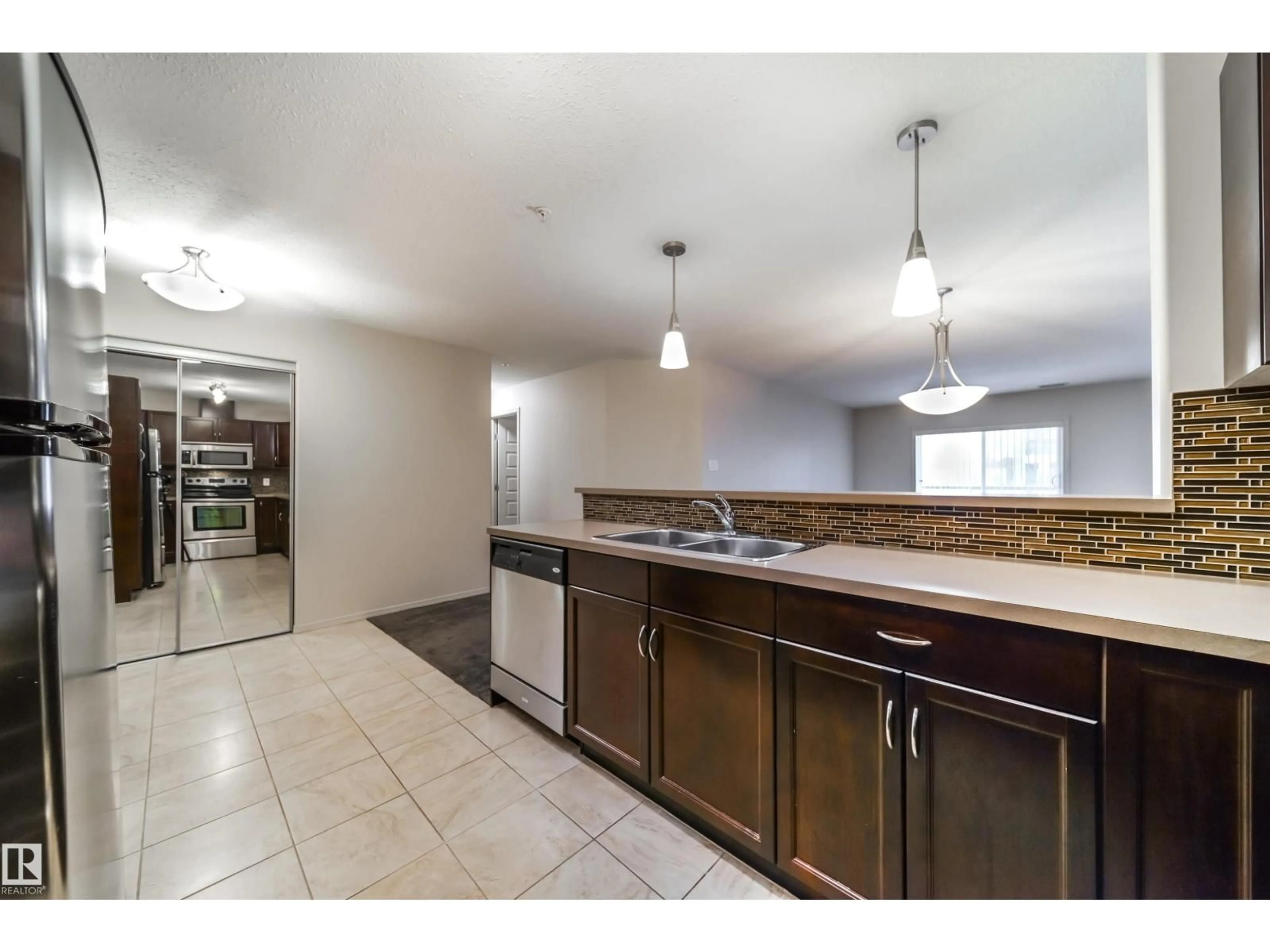 Open concept kitchen, unknown for #124 - 7909 71 ST, Edmonton Alberta T6B3P5