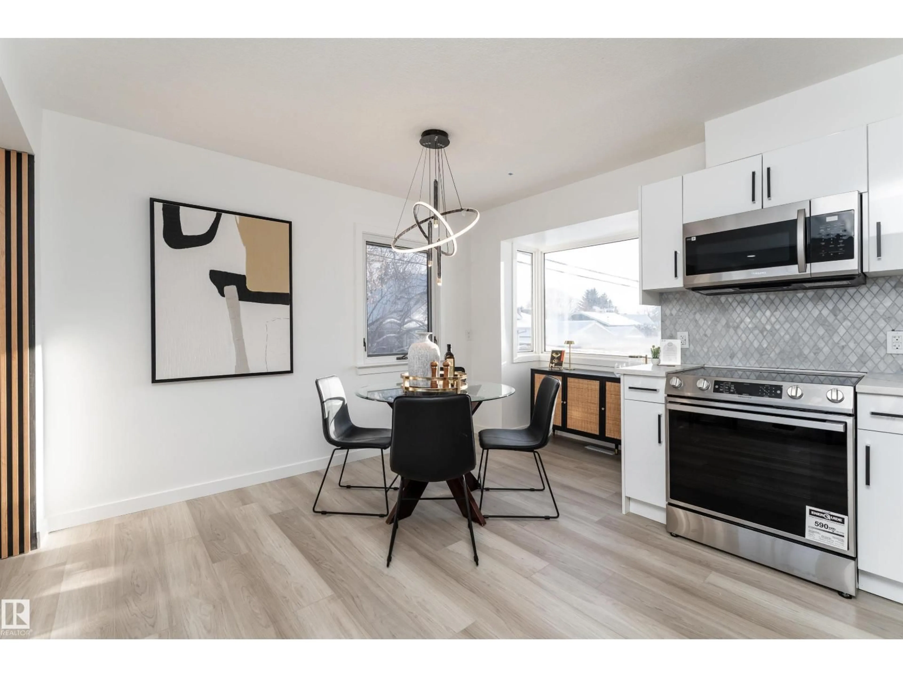 Open concept kitchen, wood/laminate floor for 13307 116 AV, Edmonton Alberta T5M3E4