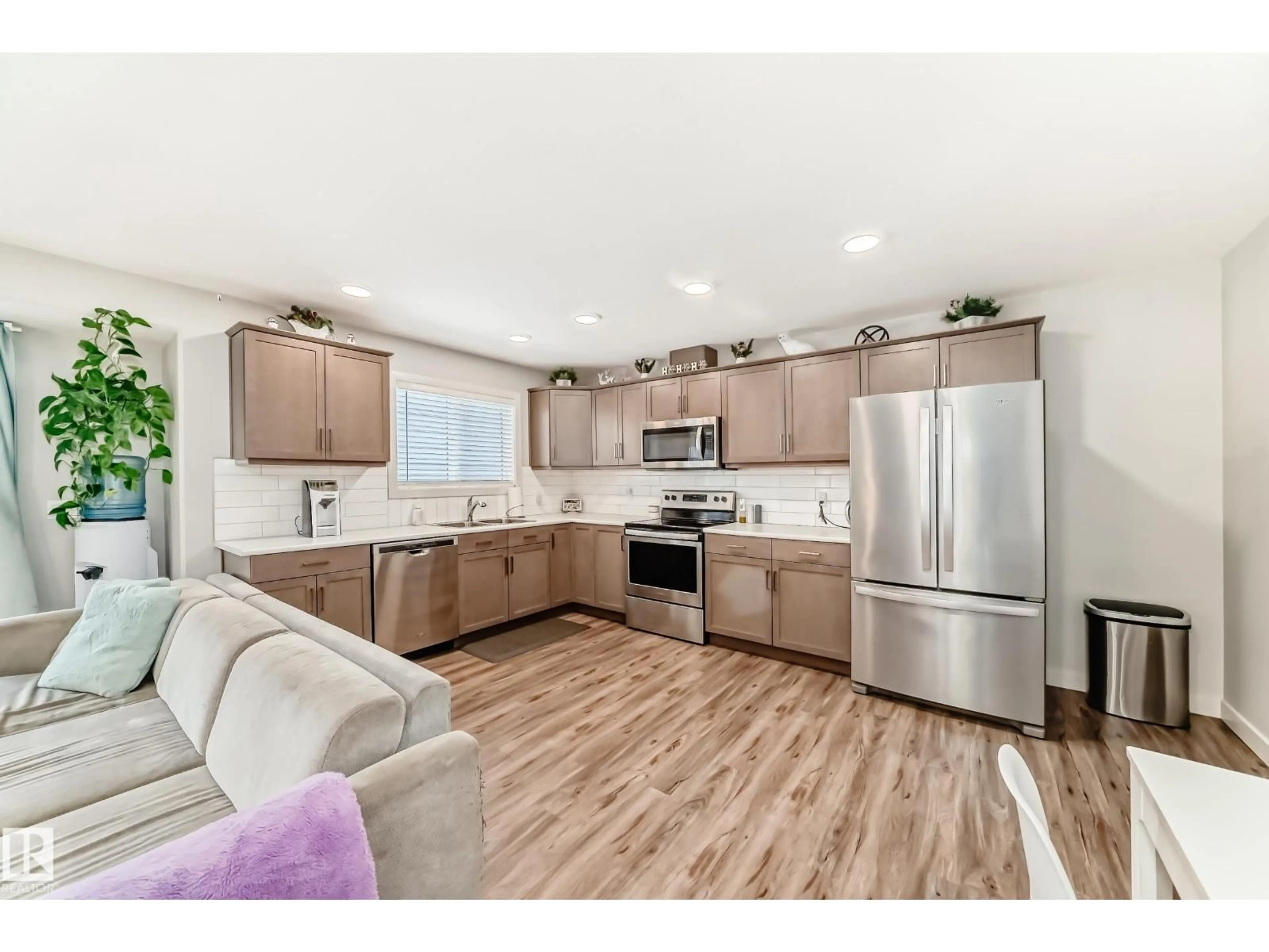 Open concept kitchen, wood/laminate floor for #102 - 300 AWENTIA DR, Leduc Alberta T9E1H3