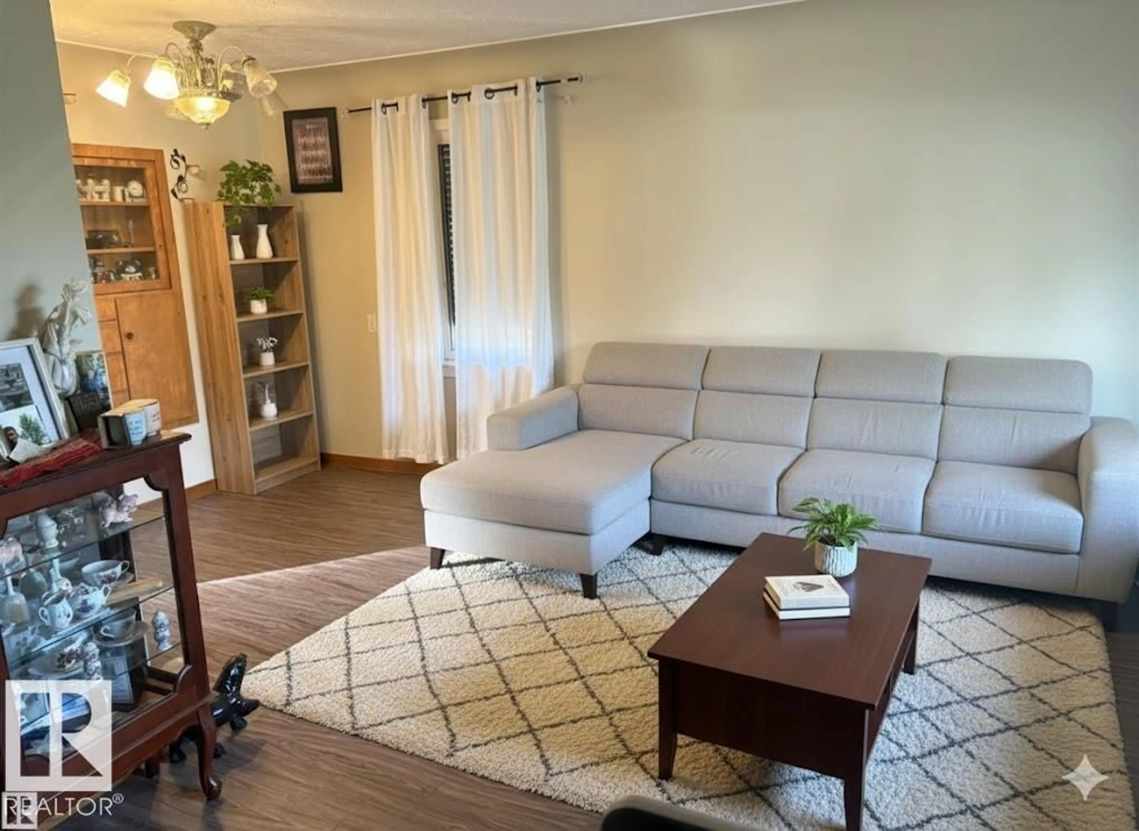 Living room with furniture, wood/laminate floor for 4840 50 ST, Gibbons Alberta T0A1N0