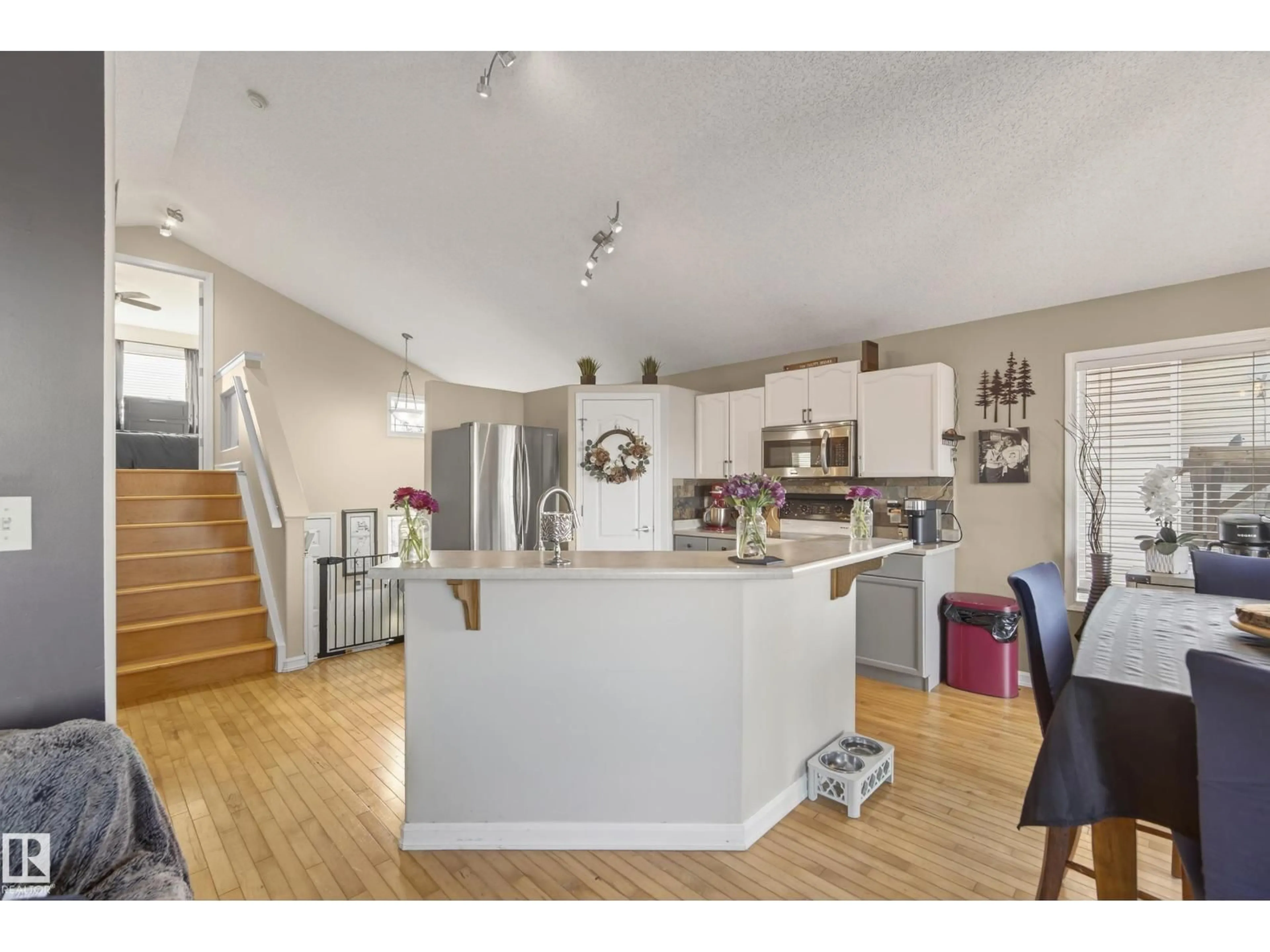 Open concept kitchen, wood/laminate floor for 3203 49 ST, Beaumont Alberta T4X1R6