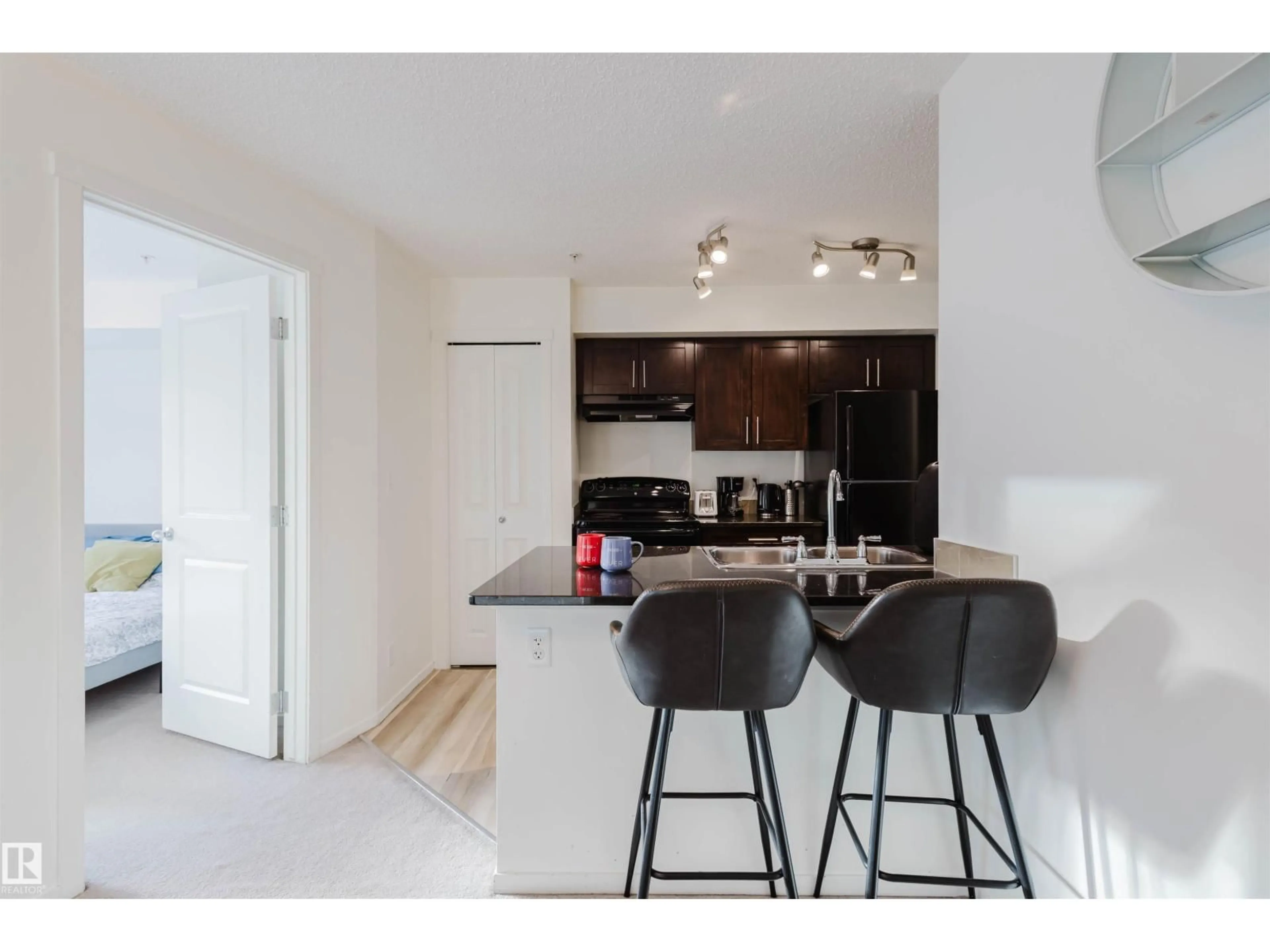 Open concept kitchen, unknown for #313 - 5816 MULLEN PL, Edmonton Alberta T6R0W3