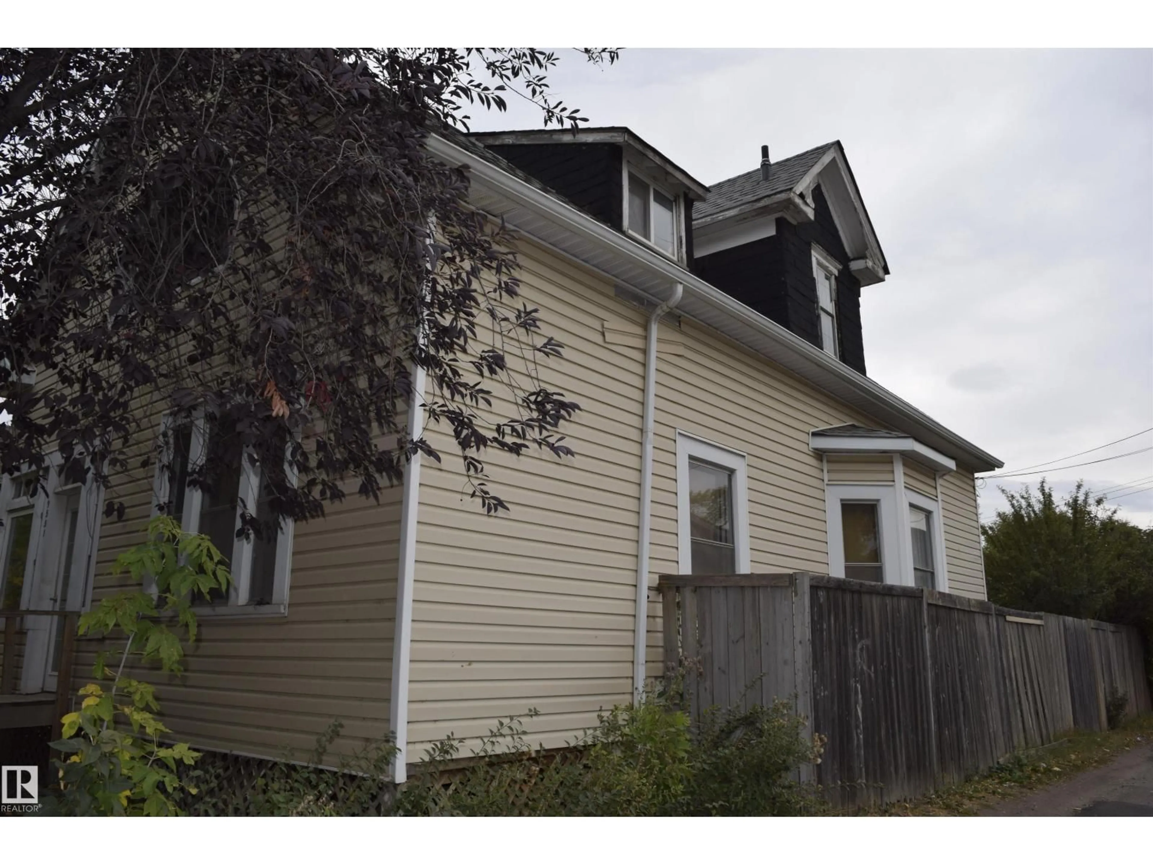 Home with vinyl exterior material, street for 9551 106A AV, Edmonton Alberta T5H0S9