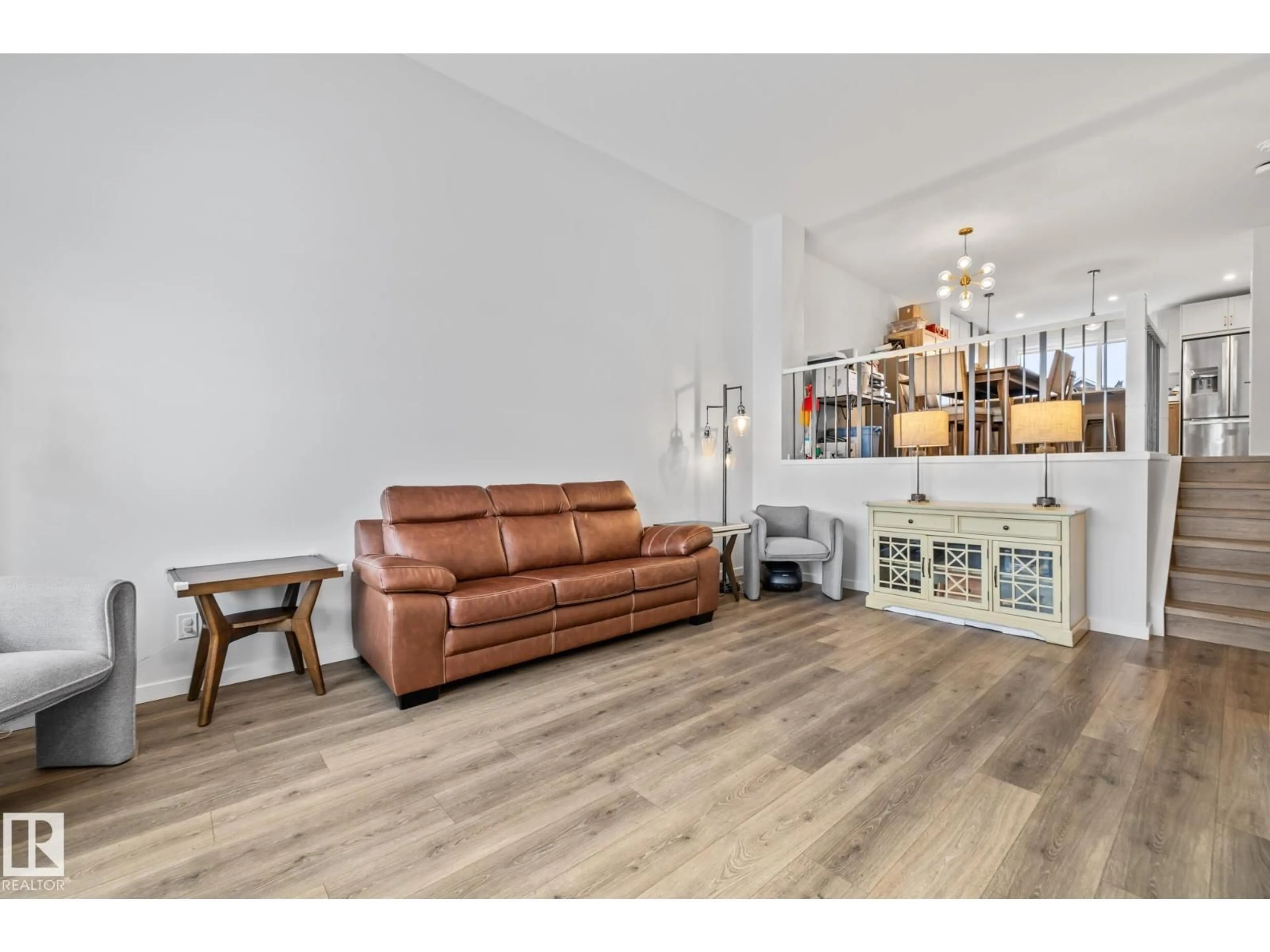 Living room with furniture, wood/laminate floor for NW - 17227 3 ST, Edmonton Alberta T5Y6G4