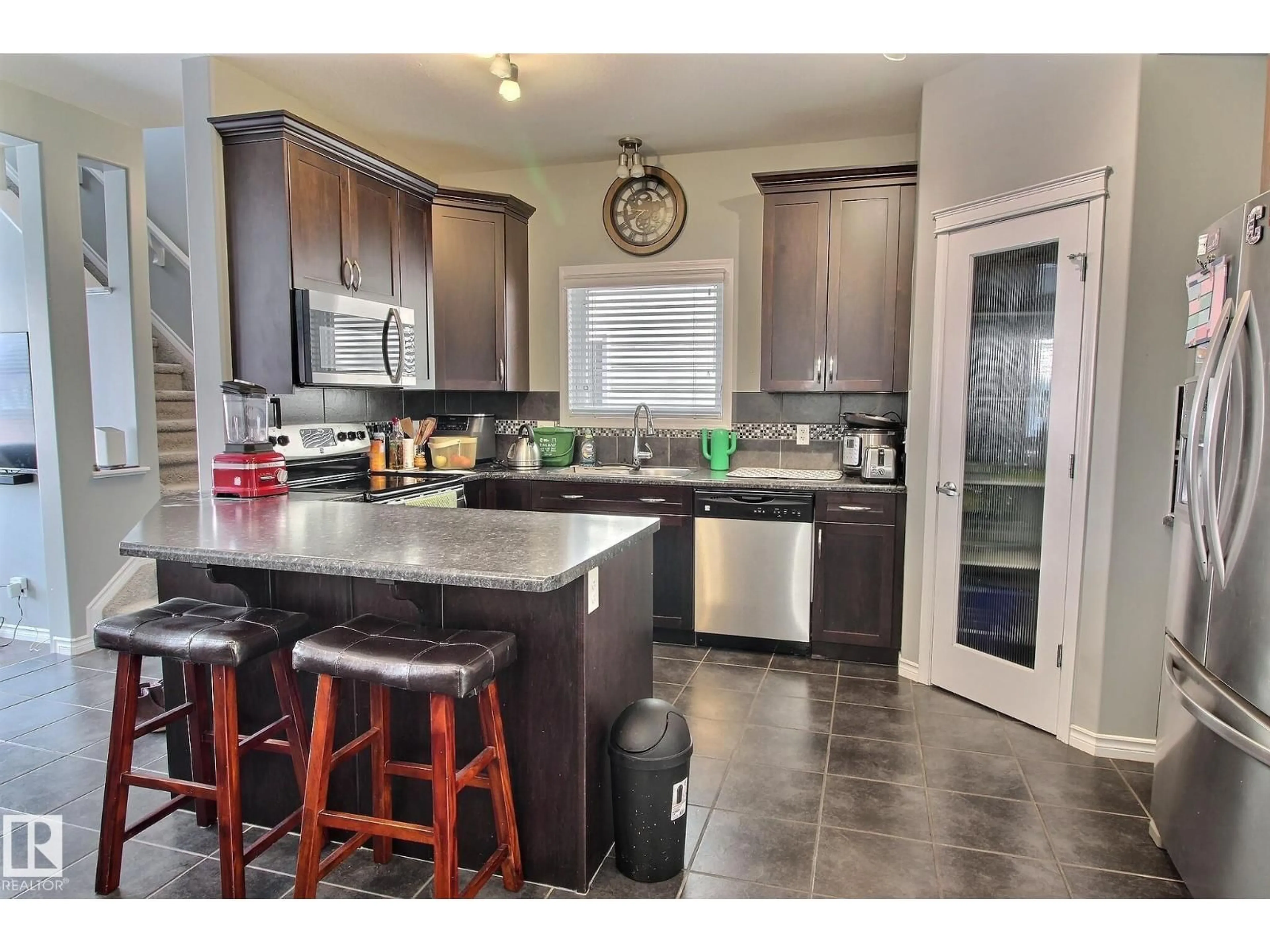 Open concept kitchen, ceramic/tile floor for 6912 22 AV, Edmonton Alberta T6X0V4
