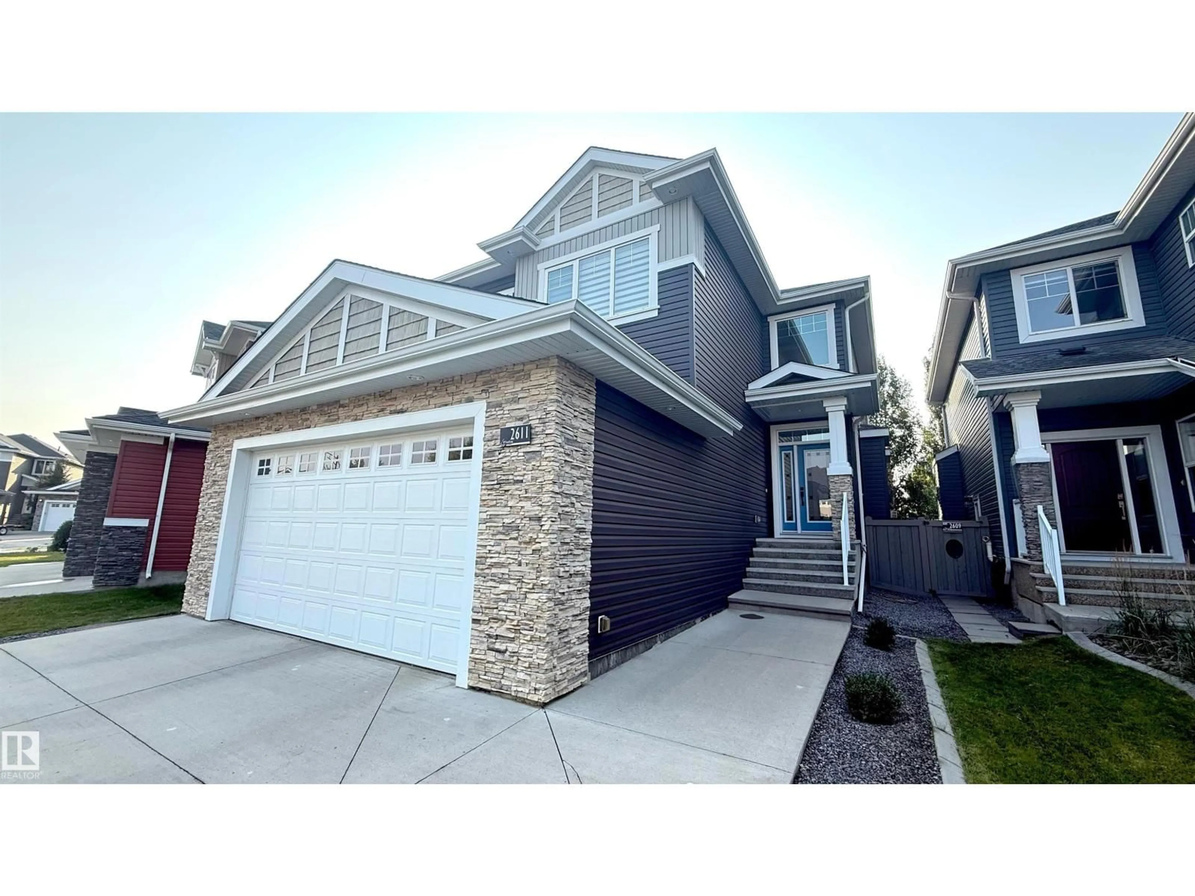 Home with vinyl exterior material, street for 2611 BLUE JAY CL, Edmonton Alberta T5S0J7