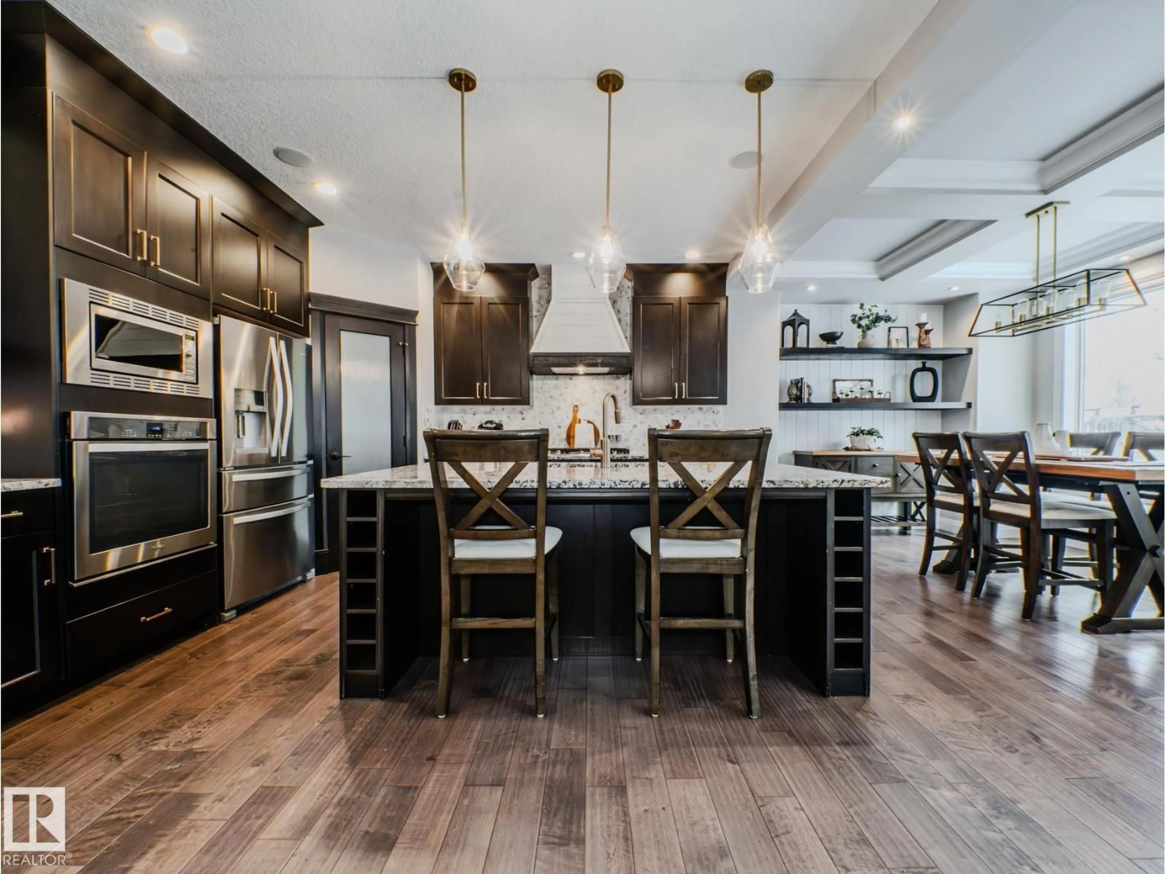 Open concept kitchen, wood/laminate floor for 2611 BLUE JAY CL, Edmonton Alberta T5S0J7