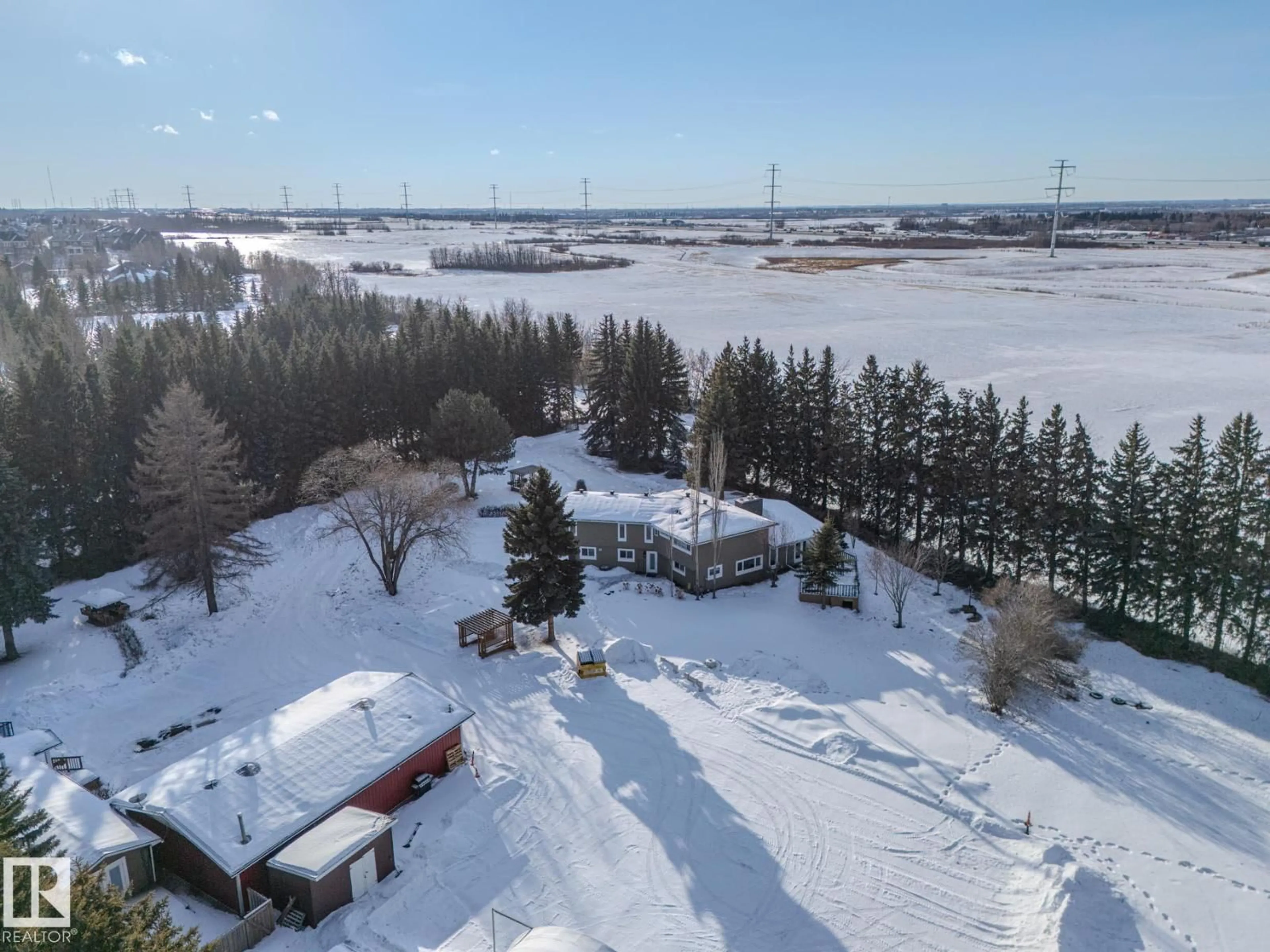 A pic from outside/outdoor area/front of a property/back of a property/a pic from drone, water/lake/river/ocean view for 80 23333 WYE RD, Rural Strathcona County Alberta T8B1K4