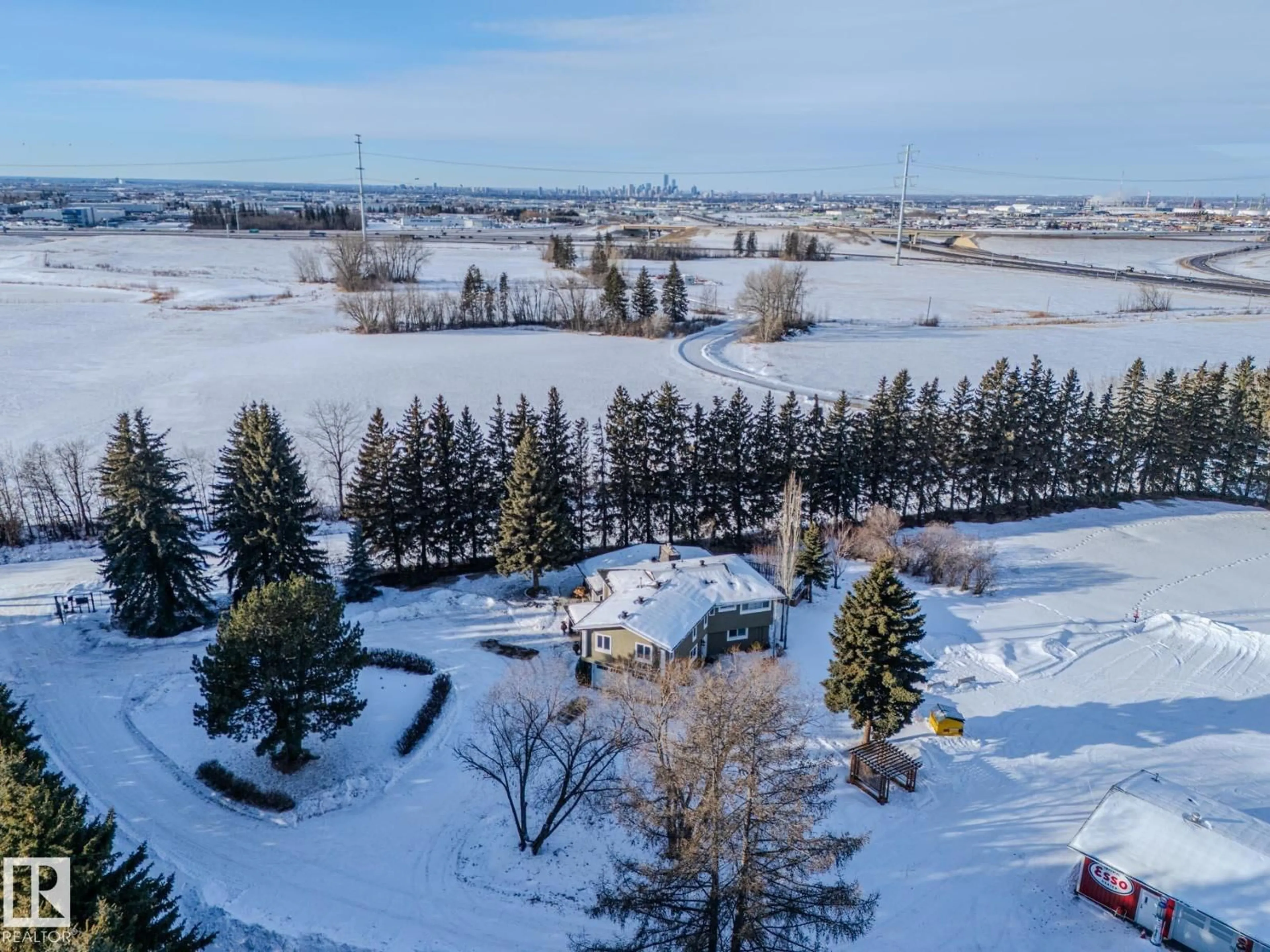 A pic from outside/outdoor area/front of a property/back of a property/a pic from drone, unknown for 80 23333 WYE RD, Rural Strathcona County Alberta T8B1K4