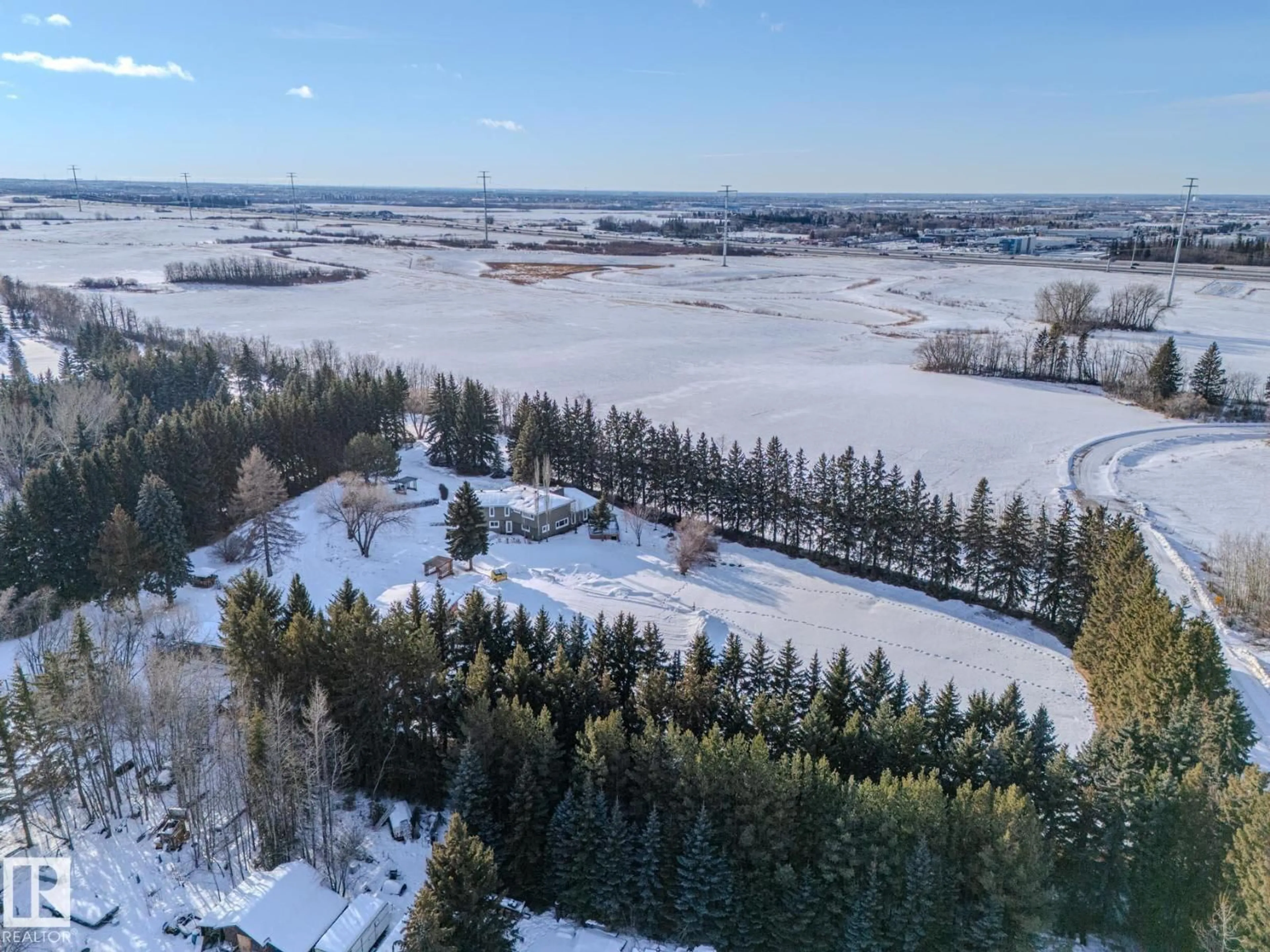 A pic from outside/outdoor area/front of a property/back of a property/a pic from drone, forest/trees view for 80 23333 WYE RD, Rural Strathcona County Alberta T8B1K4