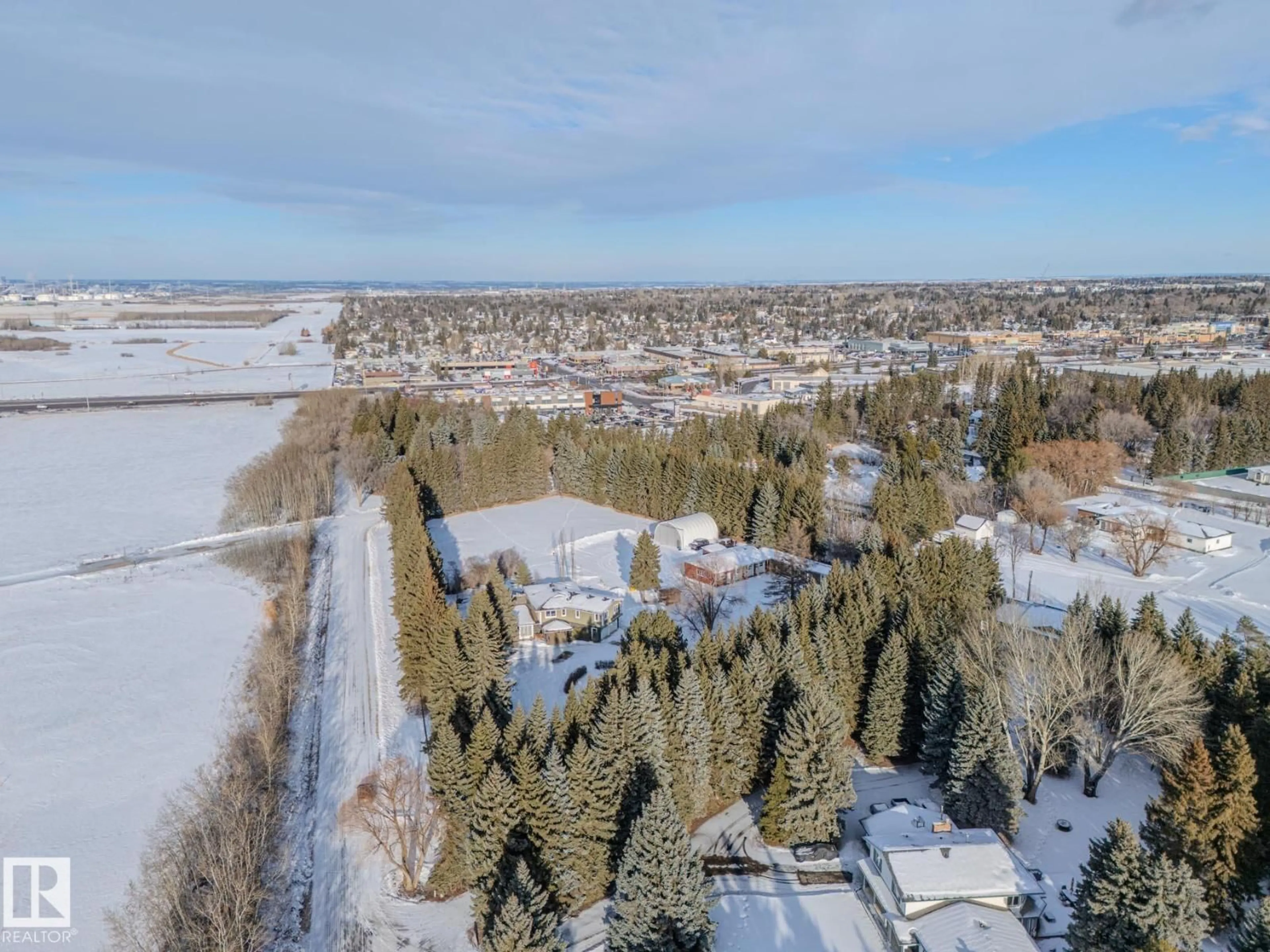 A pic from outside/outdoor area/front of a property/back of a property/a pic from drone, unknown for 80 23333 WYE RD, Rural Strathcona County Alberta T8B1K4