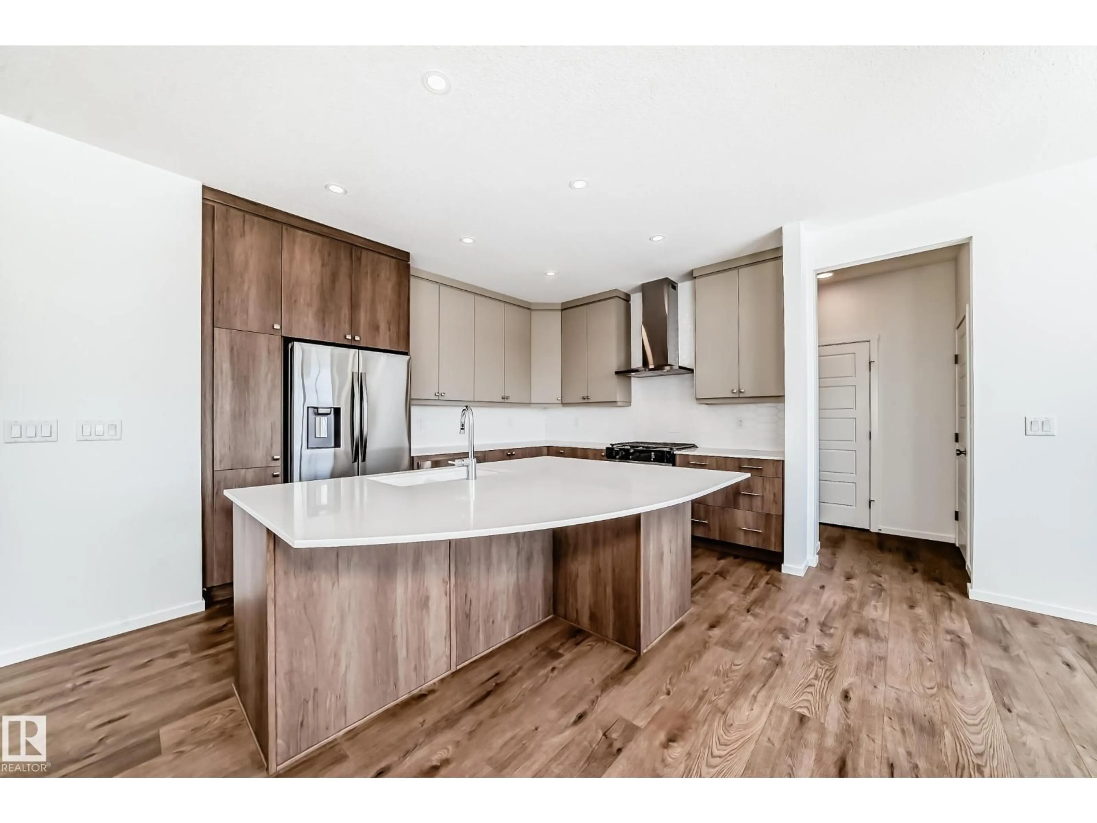 Open concept kitchen, wood/laminate floor for NW - 1524 206 ST, Edmonton Alberta T6M3E7