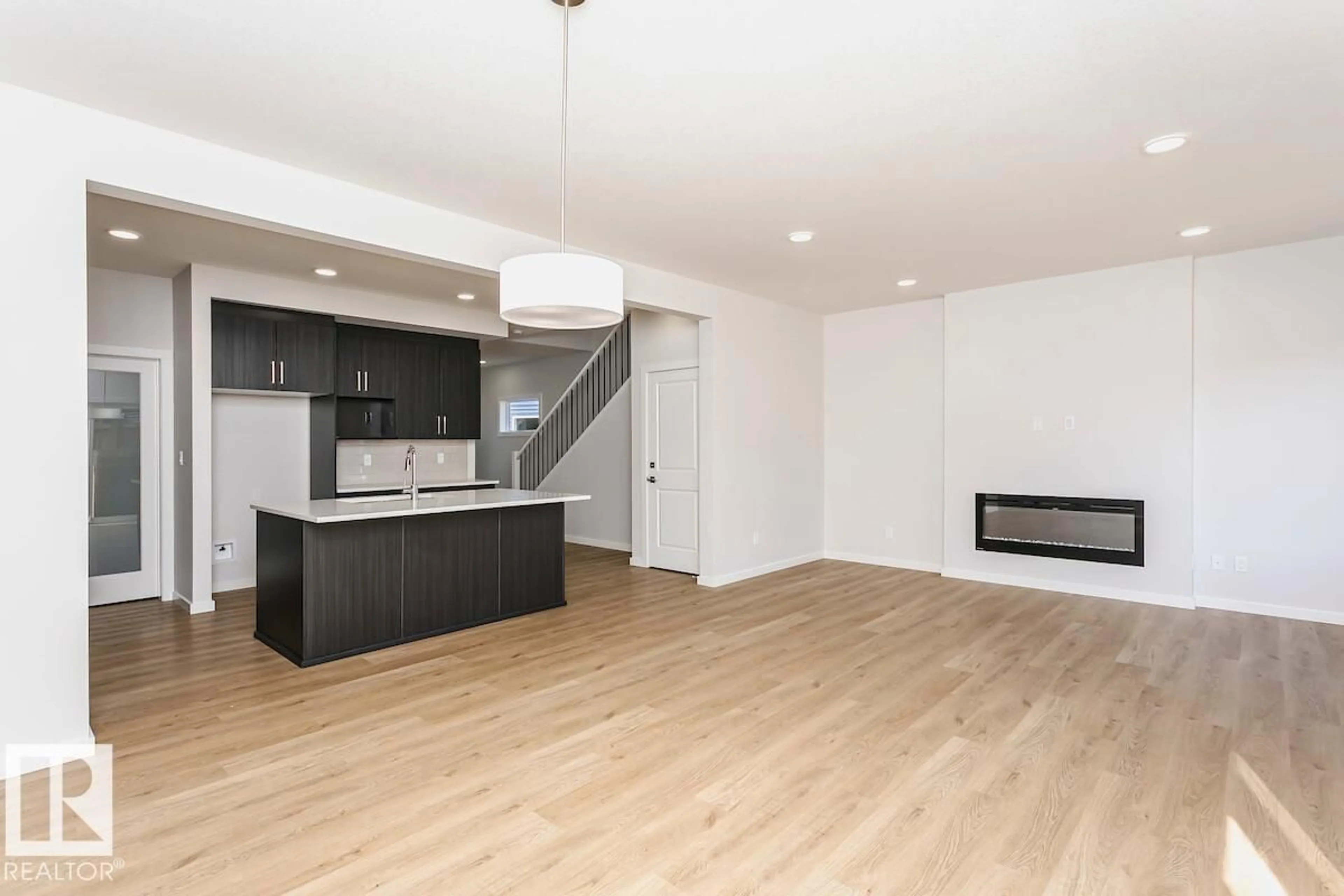 Open concept kitchen, wood/laminate floor for 6275 29 AV, Edmonton Alberta T6X3J3