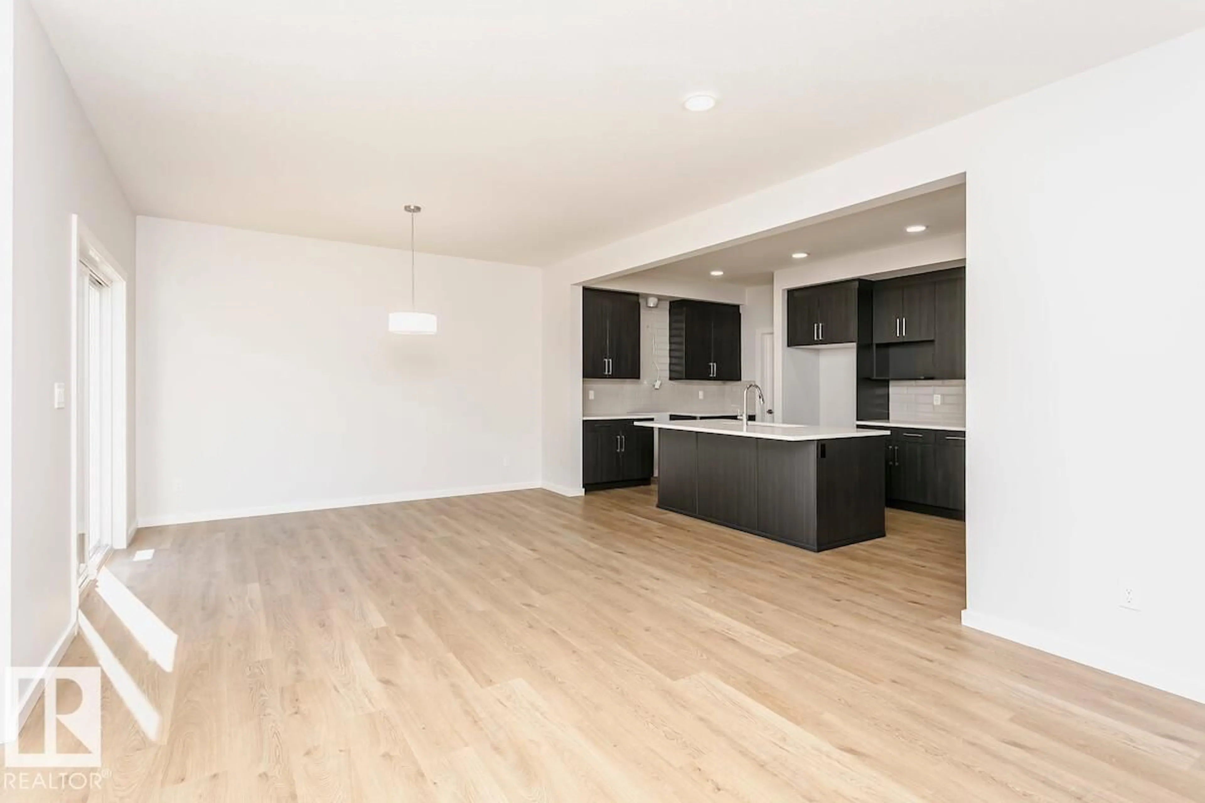 Open concept kitchen, wood/laminate floor for 6275 29 AV, Edmonton Alberta T6X3J3