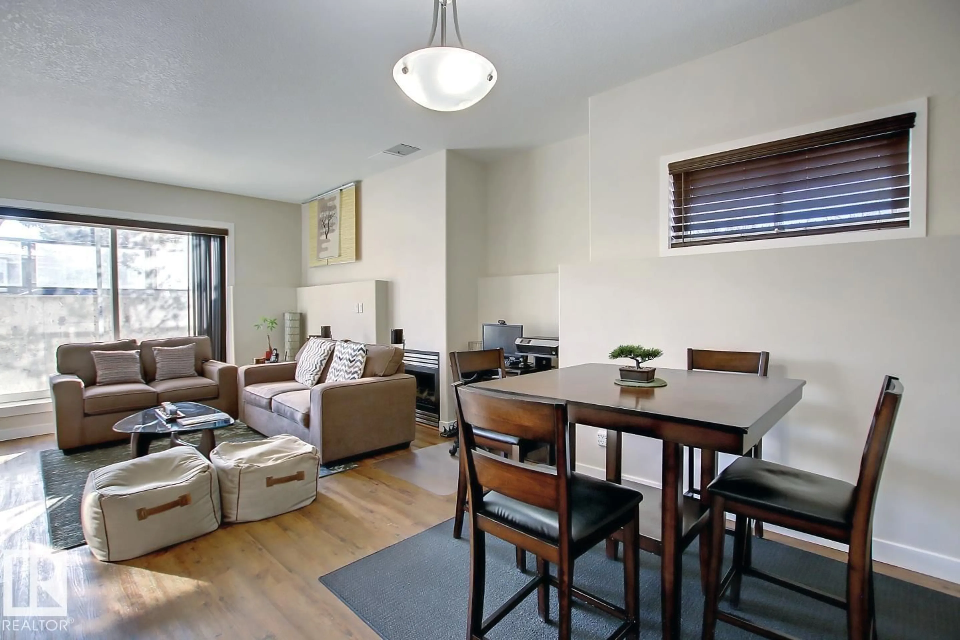 Living room with furniture, wood/laminate floor for #102 - 10905 109 ST NW, Edmonton Alberta T5H3C2