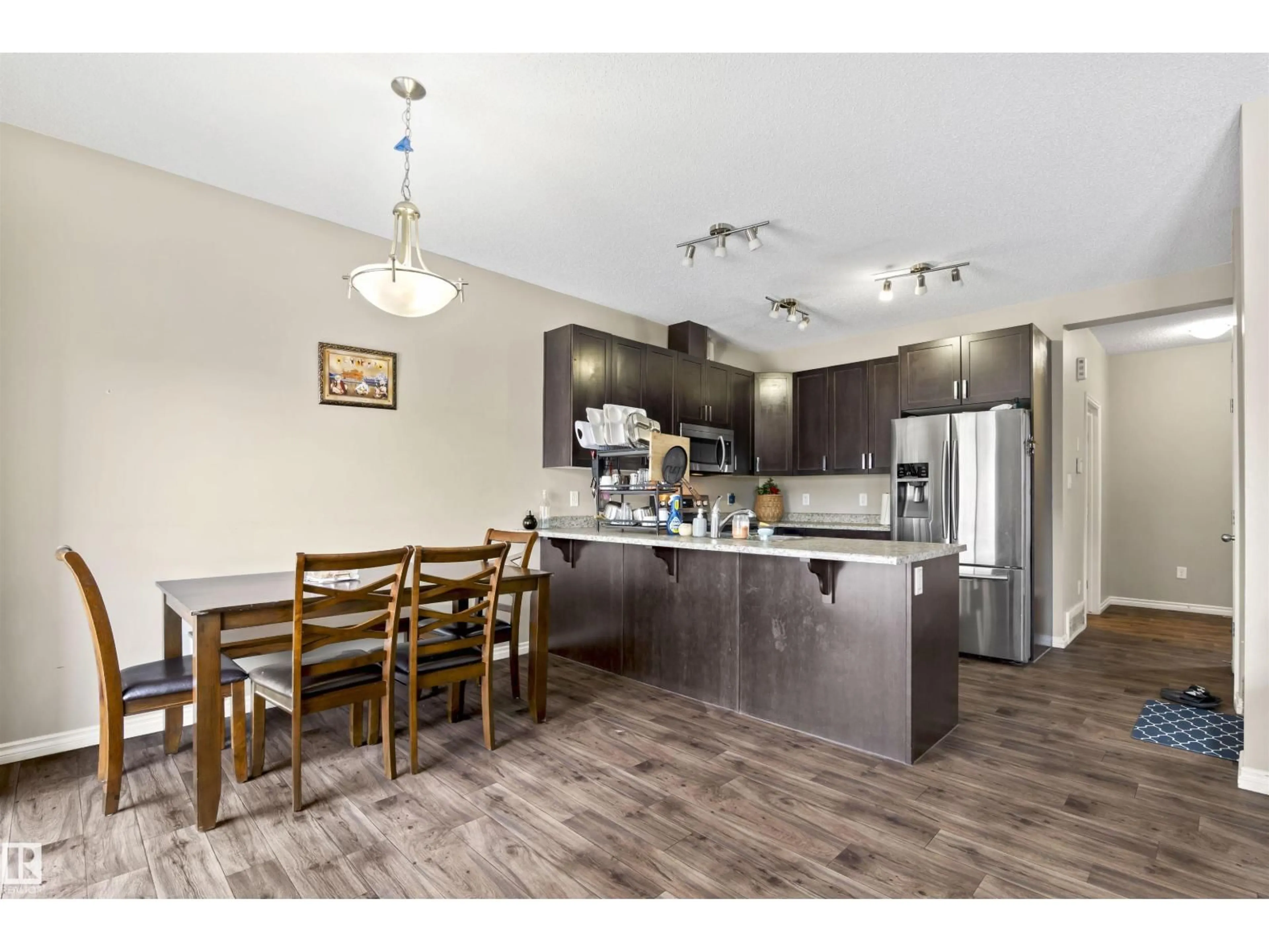 Open concept kitchen, wood/laminate floor for 2526 19A AVENUE AVENUE, Edmonton Alberta T6T2E1